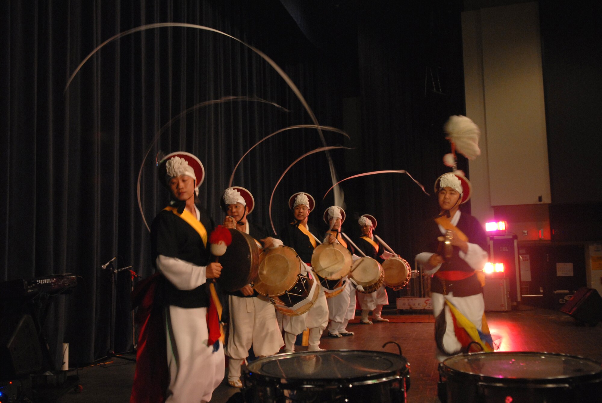KUNSAN AIR BASE, Republic Of Korea -- Drummers and Dancers  from the Heuksori Korean drum and dance team perform here Sept. 5. The Korean American Golf Association and the Korean Employee Golf Association sponsored this event free for all servicemembers. (US Air Photo by Senior Airman Angela Ruiz)