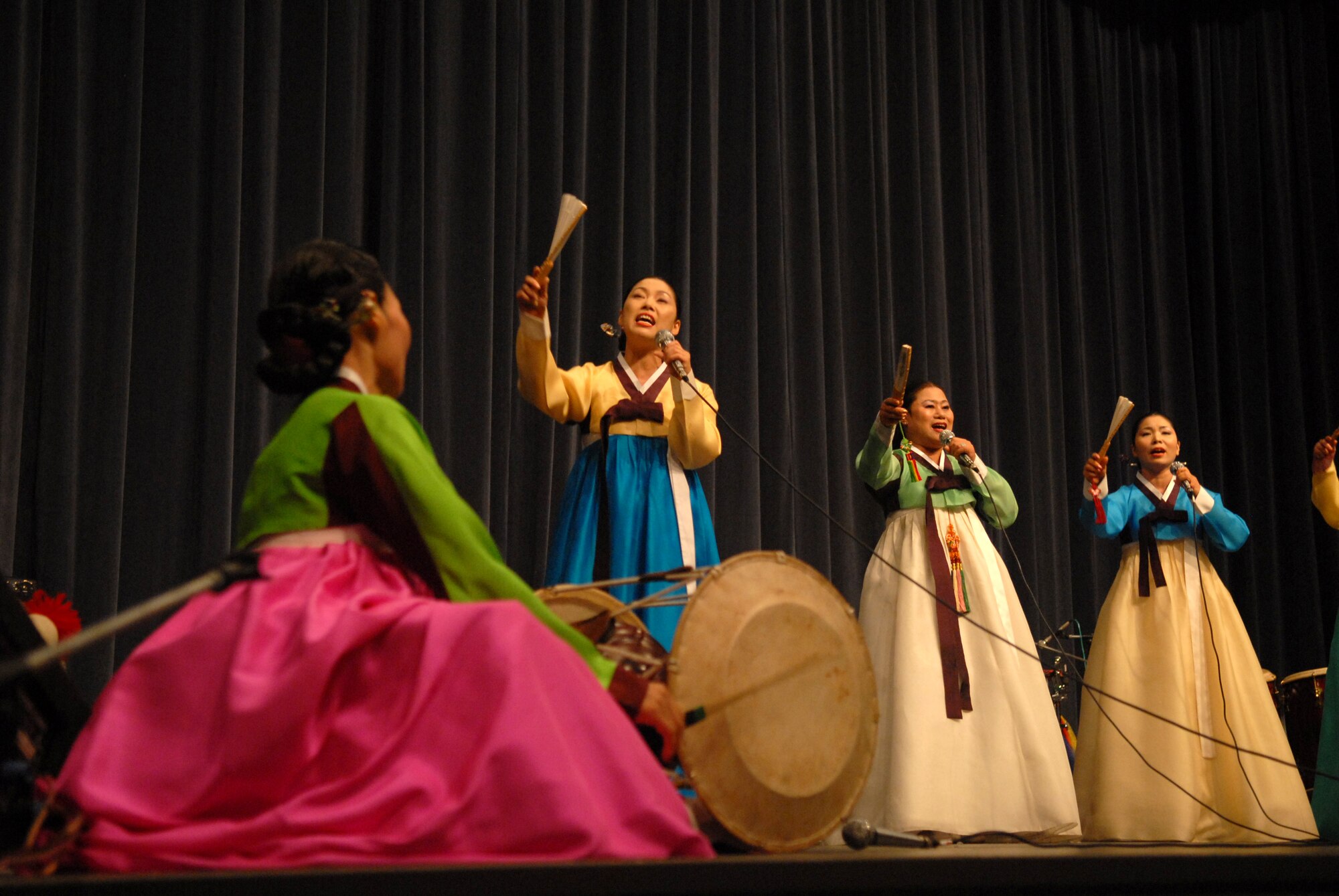 KUNSAN AIR BASE, Republic Of Korea -- Singers  from the Heuksori Korean drum and dance team perform here Sept. 5. The Korean American Golf Association and the Korean Employee Golf Association sponsored this event free for all servicemembers. (US Air Photo by Senior Airman Angela Ruiz)