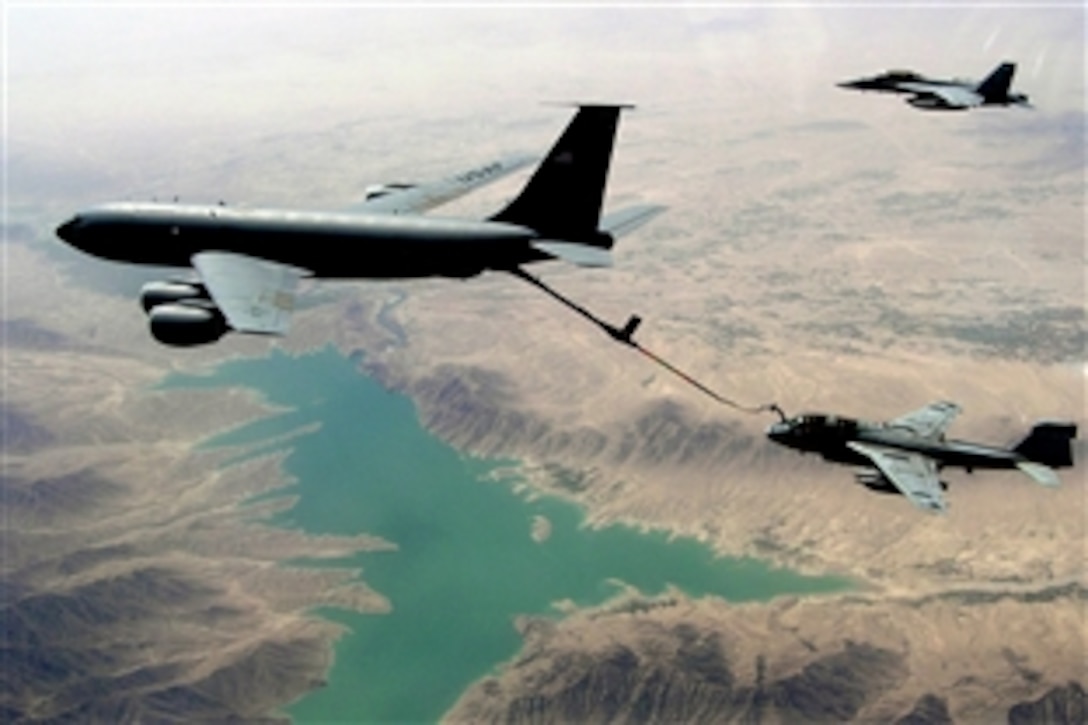 A U.S. Air Force KC-135R Stratotanker re-fuels a U.S. Navy EA-6B Prowler assigned to Tactical Electronic Warfare Squadron 139 while a U.S. Air Force F/A-18F Super Hornet aircraft assigned to Strike Fighter Squadron 22 flies alongside providing security above the Helmand Province of Afghanistan, Sept. 4, 2008. The aircraft are supporting NATO and Afghan forces as part of Operation Enduring Freedom.