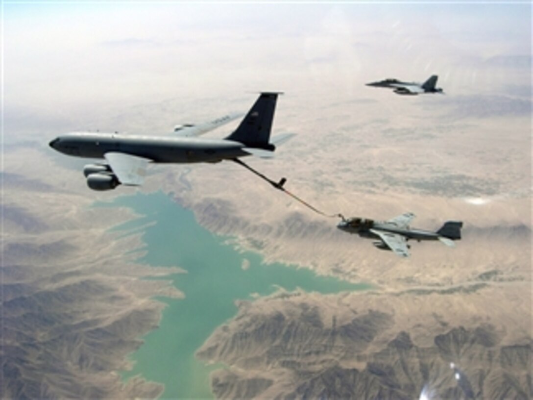 A U.S. Air Force KC-135R Stratotanker aircraft refuels a U.S. Navy EA-6B Prowler aircraft assigned to Tactical Electronic Warfare Squadron 139 while a U.S. Navy F/A-18F Super Hornet aircraft assigned to Strike Fighter Squadron 22 flies alongside providing security above the Helmand Province of Afghanistan on Sep. 4, 2008.  The aircraft are supporting NATO and Afghan forces as part of Operation Enduring Freedom.  