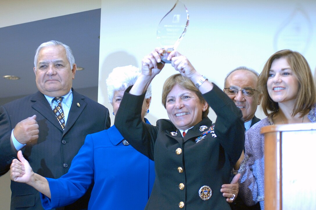 Brig. Gen. Angela Salinas shows the 2008 Latinas in Service Award to a crowd Sep. 7 at the Walter E. Washington Convention Center. Representatives from the Congressional Hispanic Caucus Institute honored Salinas for her leadership and for being a revolutionary Latina. Behind her stand congressmen and congresswomen (left to right) Silvestre Reyes, Grace Flores Napolitano, Joe Baca and Loretta Sánchez. Salinas is the highest ranking female Hispanic in the Marine Corps and the first Latina selected to the rank of brigadier general. She is currently the commanding general for Marine Corps Recruit Depot San Diego, Western Recruiting Region.