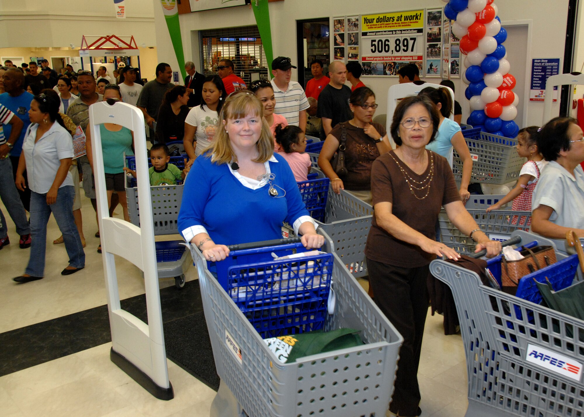 ANDERSEN AIR FORCE BASE, Guam - Members of Team Andersen and their families enter the new Base Exchange Sept. 10. The new shopping center is more than 181,000 square feet.   (U.S Air Force photo by Airman 1st Class Nichelle Griffiths)

