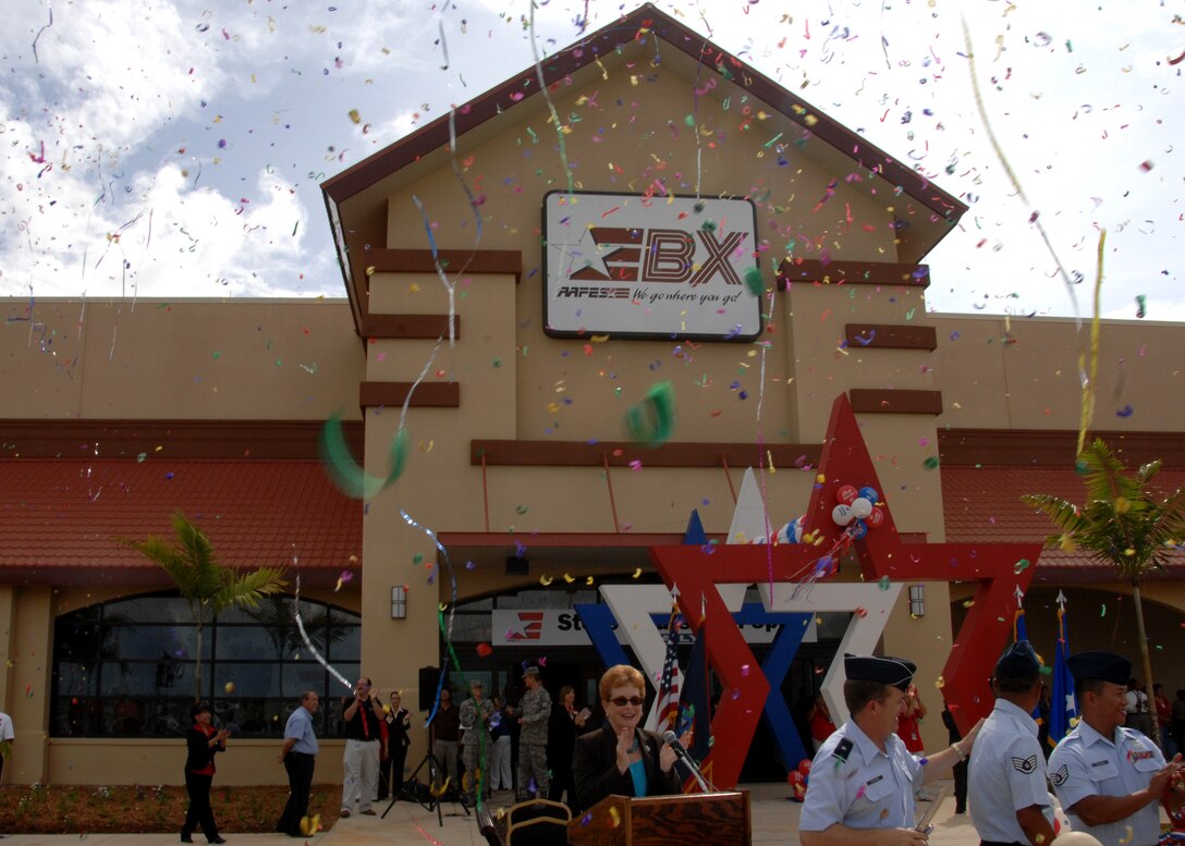 ANDERSEN AIR FORCE BASE, Guam- Members of Team Andersen and the Army and Air Force Exchange Service celebrate after the ribbon cutting ceremony of the Base Exchange here Sept. 10. The new BX, located across the street from the Car Care Gas Station, provides a wide variety of services to meet Team Andersen Airmen's needs, including six restaurants, a computer repair shop, a hair salon and many more concession shops. (U.S Air Force photo by Airman 1st Class Nichelle Griffiths)

