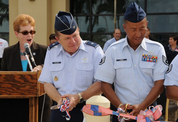 ANDERSEN AIR FORCE BASE, Guam - Brigadier Gen. Philip Ruhlman, 36th Wing commander, cuts the ribbon at the grand opening Ceremony of the new Base Exchange Sept. 10 here. The  BX is nearly seven times bigger than the old BX and establishes new employment opportunities, which benefits the local community. (U.S. Air Force photo by Staff Sgt. Jamie Lessard)