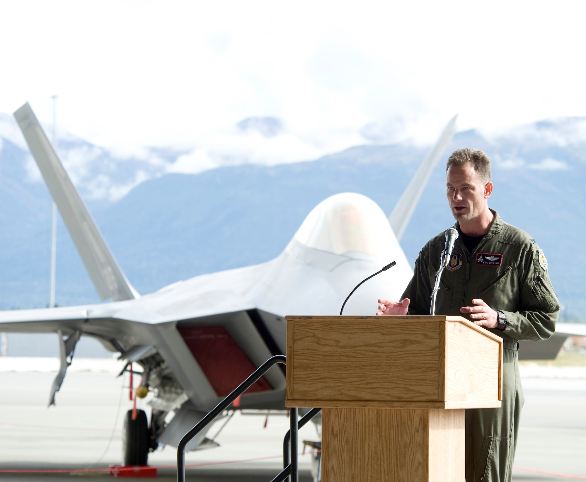 ELMENDORF AIR FORCE BASE, Alaska -- Col. Eric Overturf, 477th Fighter Group commander, speaks to the attendants of the Inital Operational Capabiltiy ceremony Sept. 5. The ceremony was held to celebrate the combat capability of the C-17 Globemaster III and the F-22A Raptor. (U.S. Air Force photo/Senior Airman Matthew Owens)