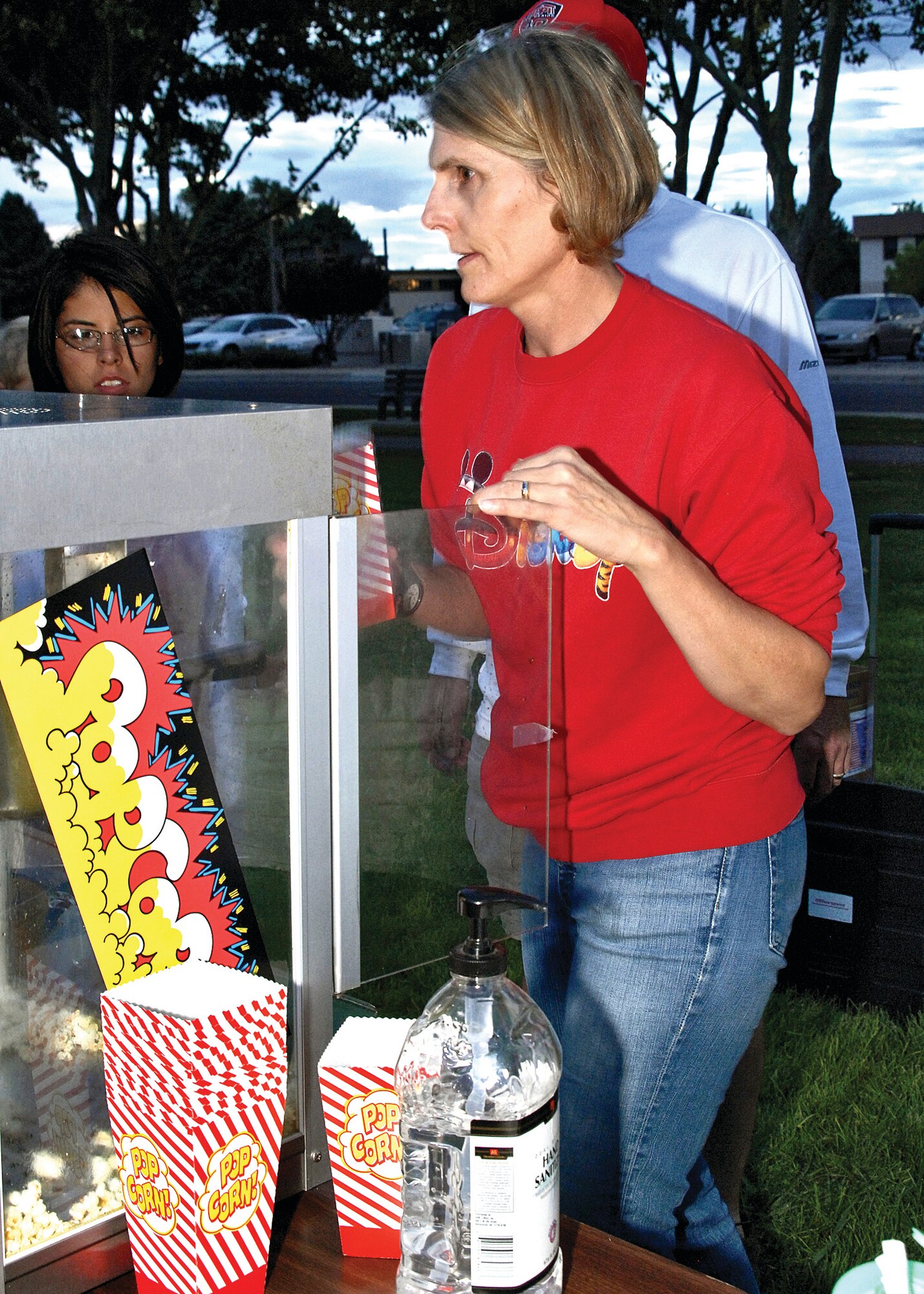 Chap. (Lt. Col.) Lisa Tice, wing chaplain, 377th Air Base Wing, volunteered to make popcorn for movie goers at the first free Movie Under the Stars at Hardin Field, Aug. 30. U.S. Air Force photo by Damian Bohannon