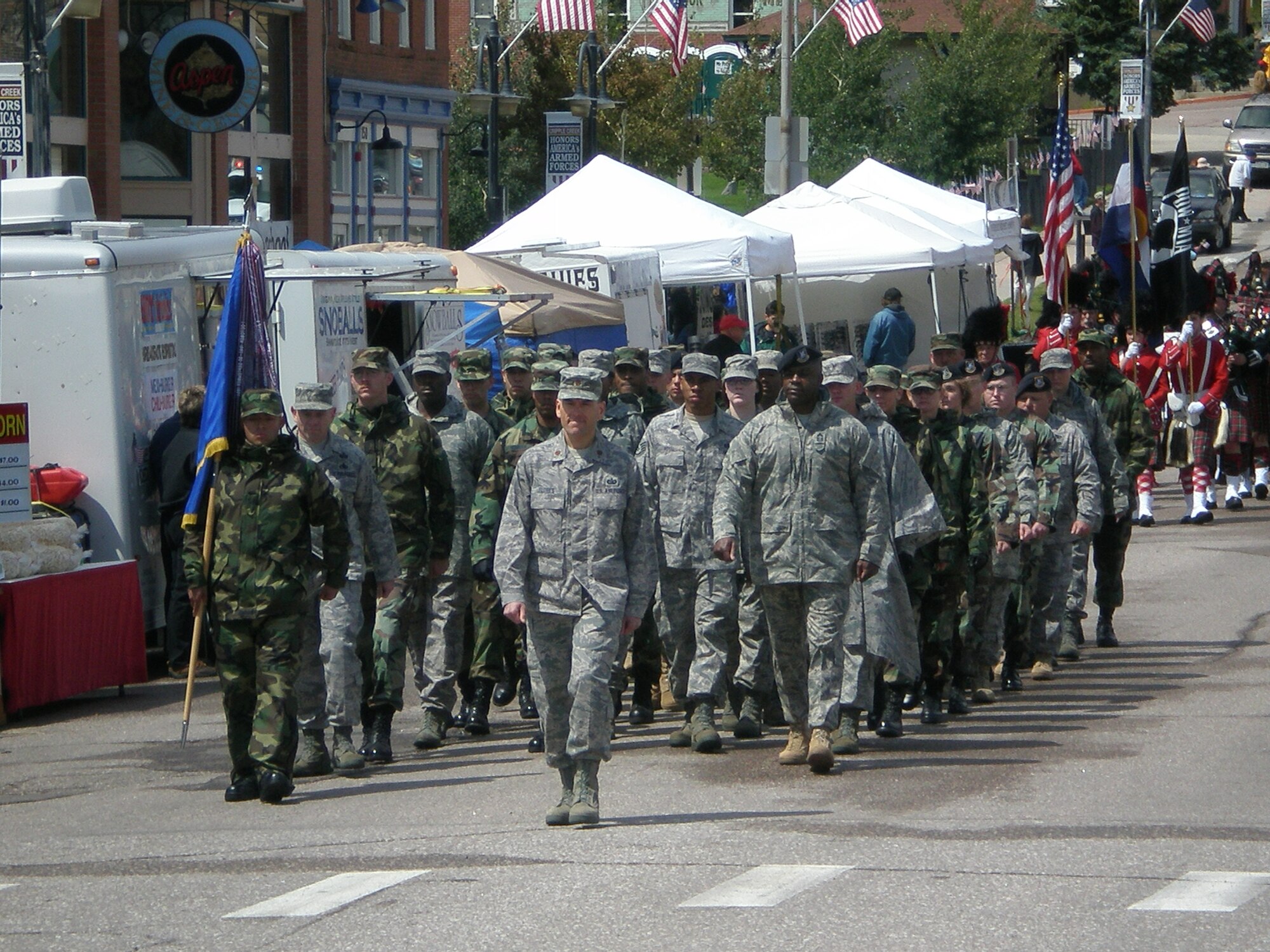 Members of the 21st Space Wing, lead by Maj. Marc Flores, represent the U.S. Air Force Aug. 16 during the 2008 Cripple Creek Honors America’s Armed Forces parade in the Colorado town. During the honorary weekend, a memorial dedication for fallen servicemembers was held for those who’ve made the ultimate sacrifice from the Pikes Peak area of the state, a fireworks display and a concert headlined by country singer Sammy Kershaw. Major Flores is assigned to Air Force Space Command. (Courtesy photo)