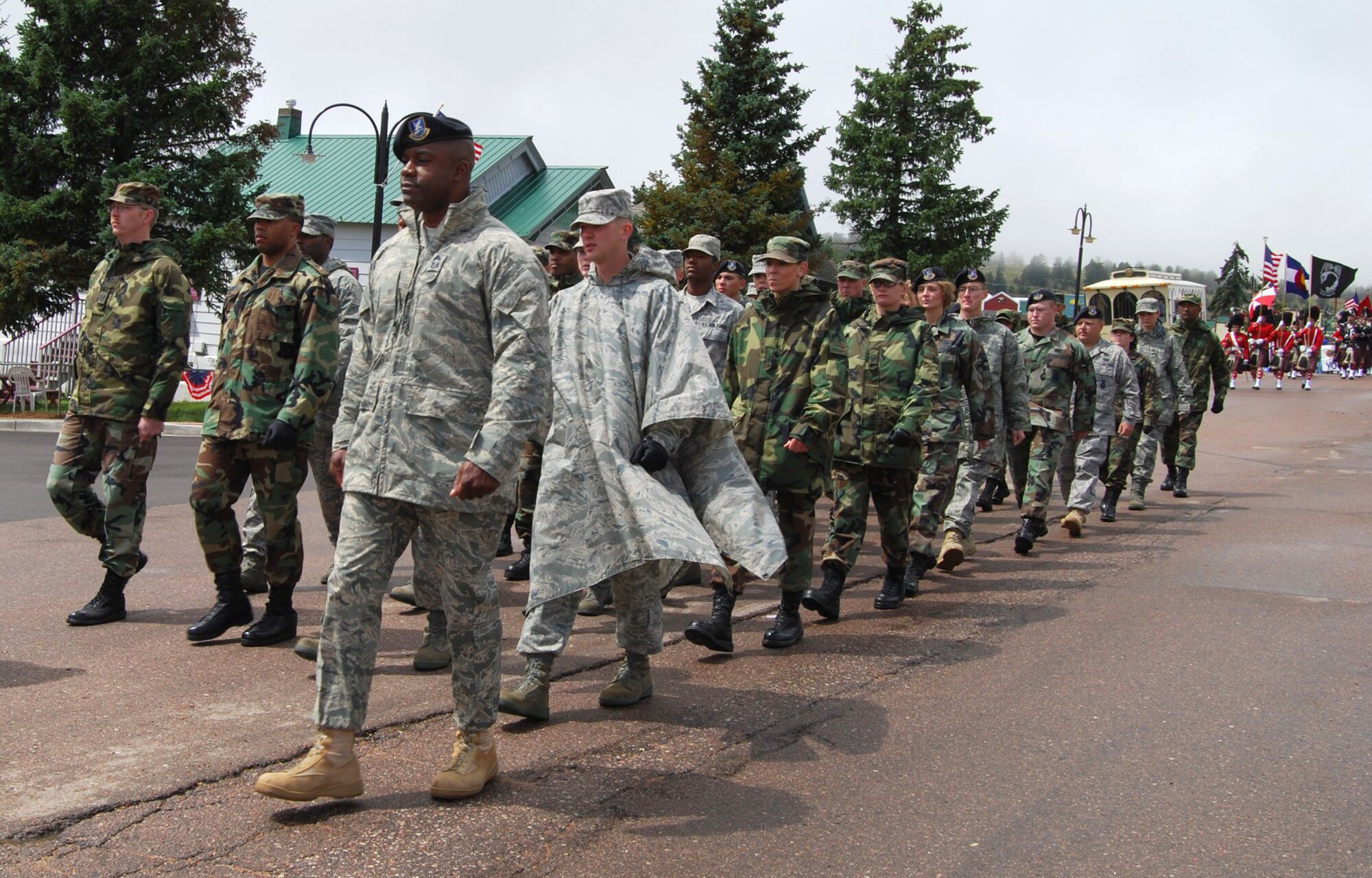 Chief Master Sgt. William Carter leads a contingent of Airmen Aug. 16 during the 2008 Cripple Creek Honors America’s Armed Forces parade in the Colorado town. During the honorary weekend, a memorial dedication for fallen servicemembers was held for those who’ve made the ultimate sacrifice from the Pikes Peak area of the state, a fireworks display and a concert headlined by country singer Sammy Kershaw. Chief Carter is the 721st Security Forces Squadron superintendent. (Courtesy photo)