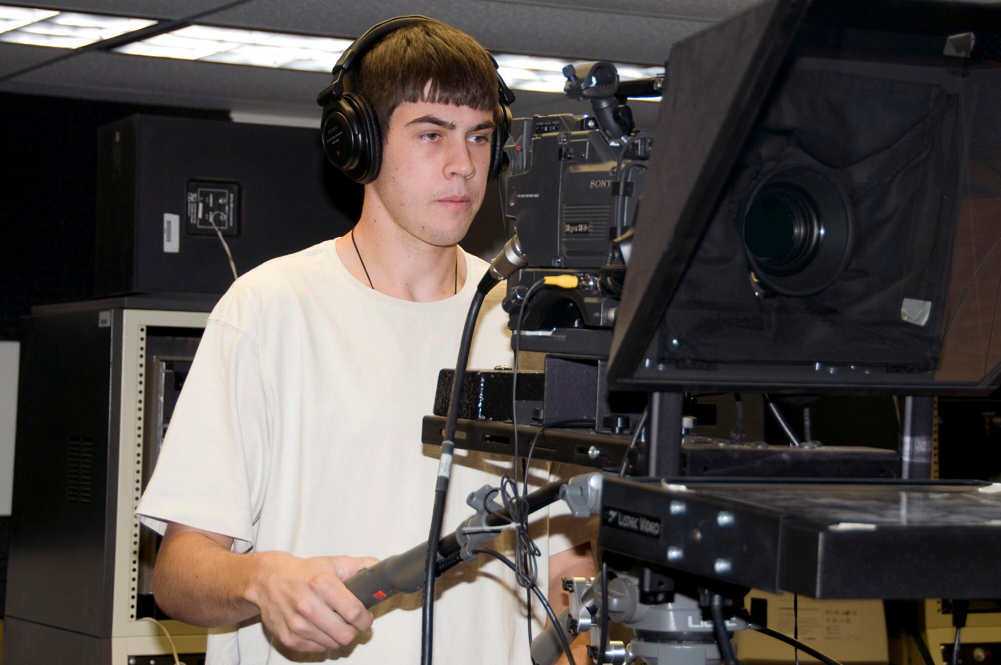 During a filming session, Ethan Halliday operates the camera as part of his duties as a student intern with the Air Force Operational Test and Evaluation Center at Kirtland Air Force Base, N.M. The intern program partners AFOTEC with the University of New Mexico to recruit students and expose them to government service, particularly in shortage career fields. (Courtesy photo)