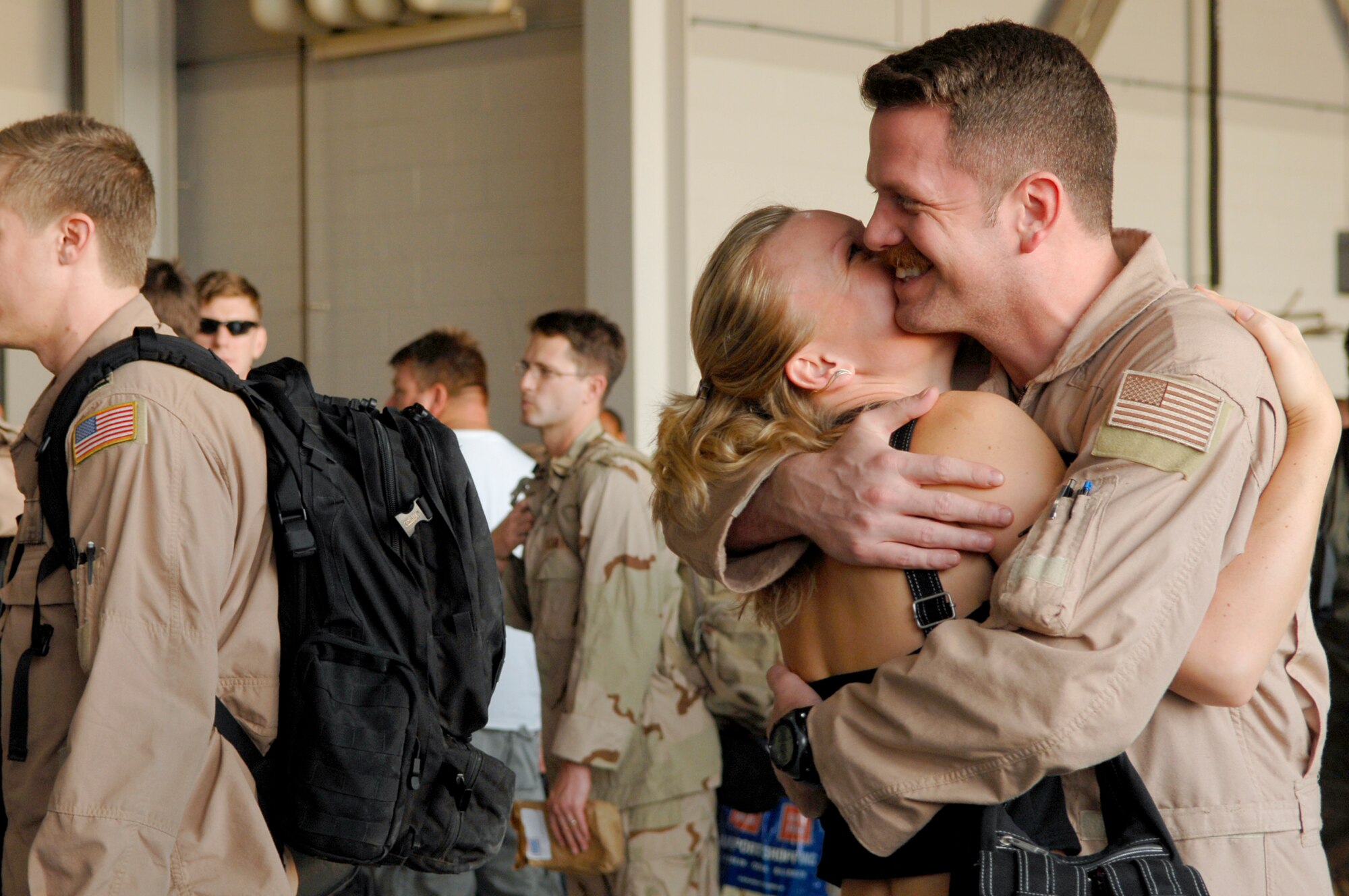 Master Sgt. Frederick Hutcheson, 1st Special Operations Support Squadron, hugs his wife Marketa after returning from a deployment Sept. 6; Hurlburt Field, Fla. Operation Homecoming allows family, friends, and co-workers to reunite with their loved ones as soon as they land after a deployment. (U.S. Air Force photo/ Senior Airman Julianne Showalter)(RELEASED)