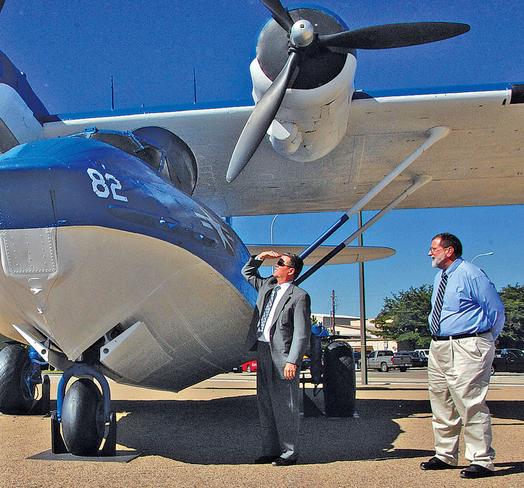 Dick Anderegg, left, Air Force director of history and museums policies and programs, takes a closer look at an OA-10, which served in the Pacific Theater during World War II, at the 58th Special Operations Wing air park. Giving him the tour on Aug. 22, is Dr. Barron Oder, Air Force Operational Test and Evaluation Center historian. The OA-10 primarily performed air-sea rescue work known as ?Dumbo? missions. U.S. Air Force photo by Todd Berenger
