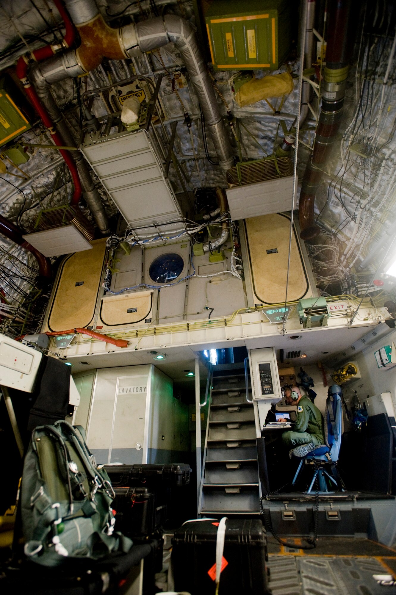 ELMENDORF AIR FORCE BASE, Alaska -- Staff Sgt. Jeremy White, a 517th Airlift Squadron loadmaster, fills out forms while in flight Sept. 5. The 517th AS can perform multiple tasks in a single flight including cargo air drop, troop delivery and air refueling to fulfill the world-wide air mobility requirements. (U.S. Air Force photo/Senior Airman Jonathan Steffen)