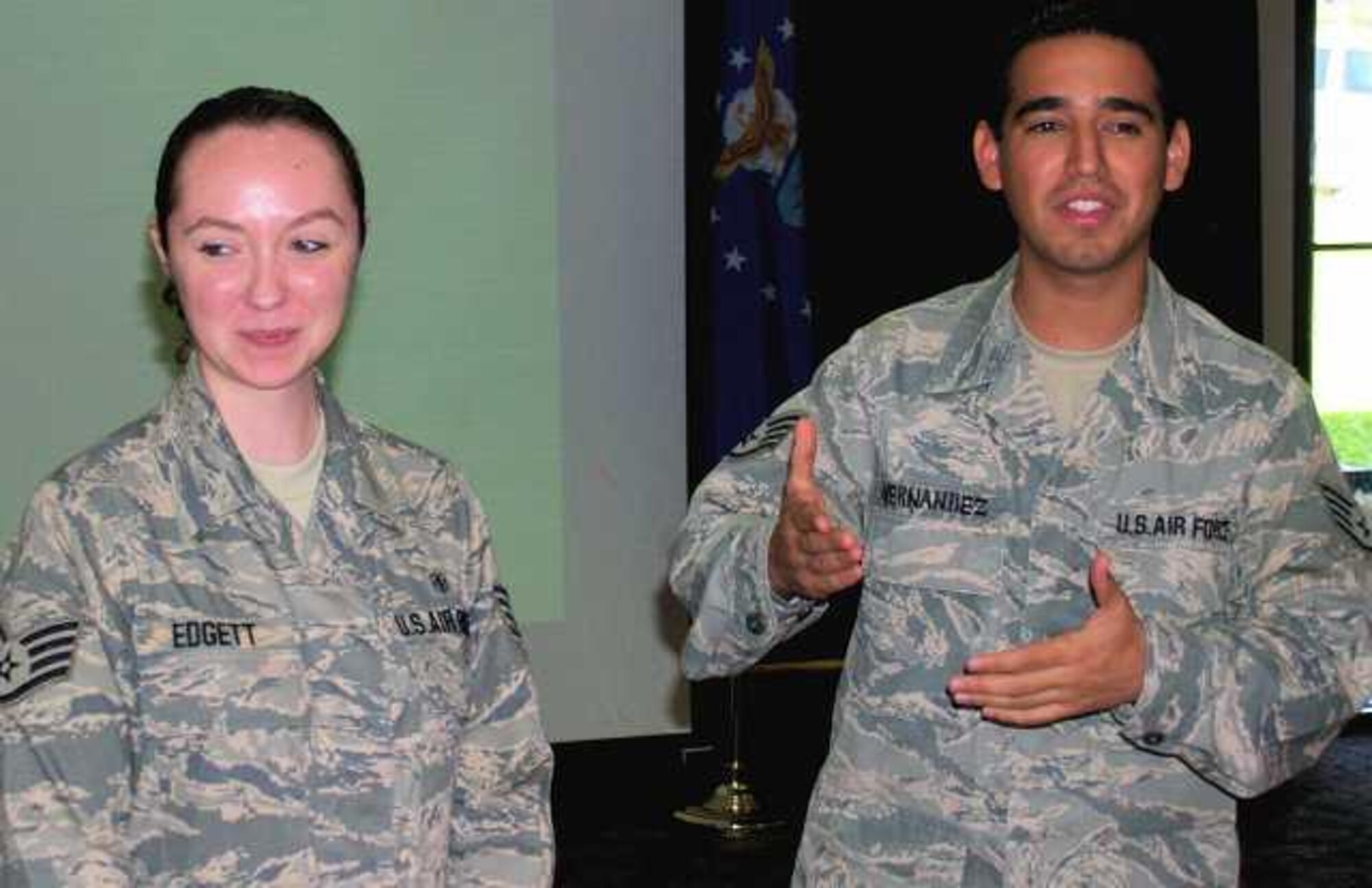 LAUGHLIN AIR FORCE BASE, Texas-- Staff Sgt. Holli Edgett, 47th Medical Support Squadron, and Staff Sgt. Carlos Hernandez, 47th Force Support Squadron, meet with Del Rio Rotary Club members during a luncheon here Sept. 2.  Sergeants Edgett and Hernandez were guest speakers for the Rotarians luncheon and discussed their recent deployments in support of Operations Enduring and Iraqi Freedom earlier this year.  Both Airmen served as Force Protection Escorts, ensuring the base was secure and its people were safe at all times.  (U.S. Air Force Photo by Bill Sontag)  