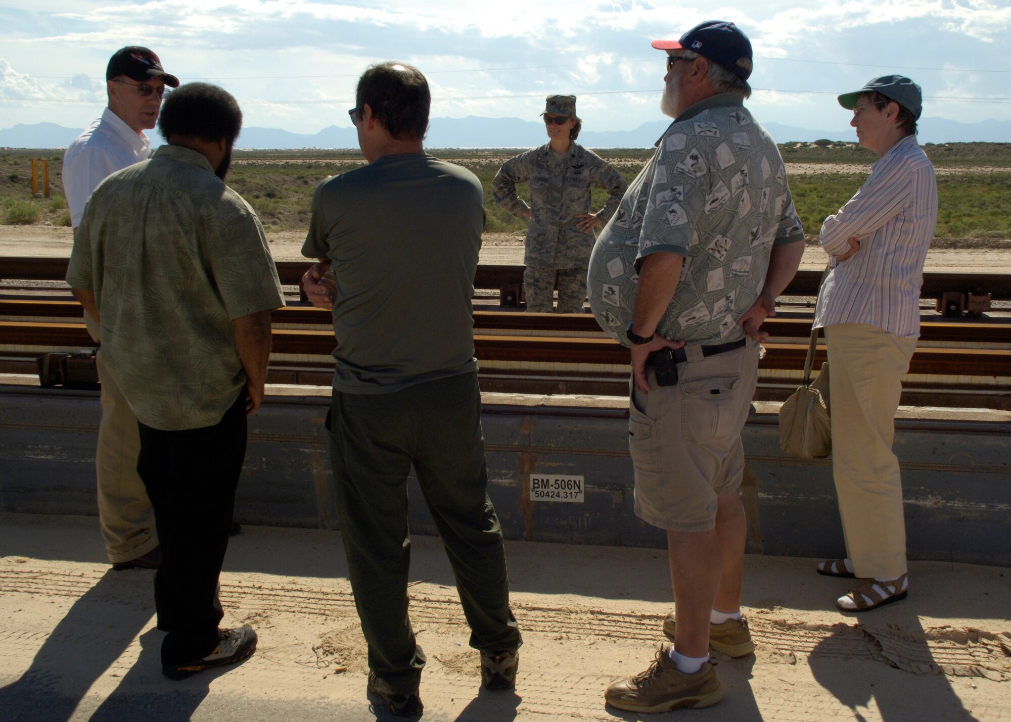 Lt. Col. Angela Suplisson, 846 Test Squadron commander, speaks with members from NASA's DC-X project during their tour of Holloman AFB, N.M., August 19. During their visit they recieved a walking tour of labs, and a bus tour of the Maglev Track. (U.S. Air Force photo/Airman 1st Class Michael Means)