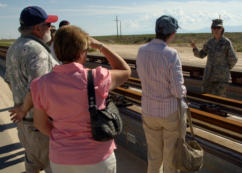 Lt. Col. Angela Suplisson, 846 Test Squadron commander, speaks with members from NASA's DC-X project during their tour of Holloman AFB, N.M., August 19. The members were celebrating their 15-year reunion. (U.S. Air Force photo/Airman 1st Class Michael Means)