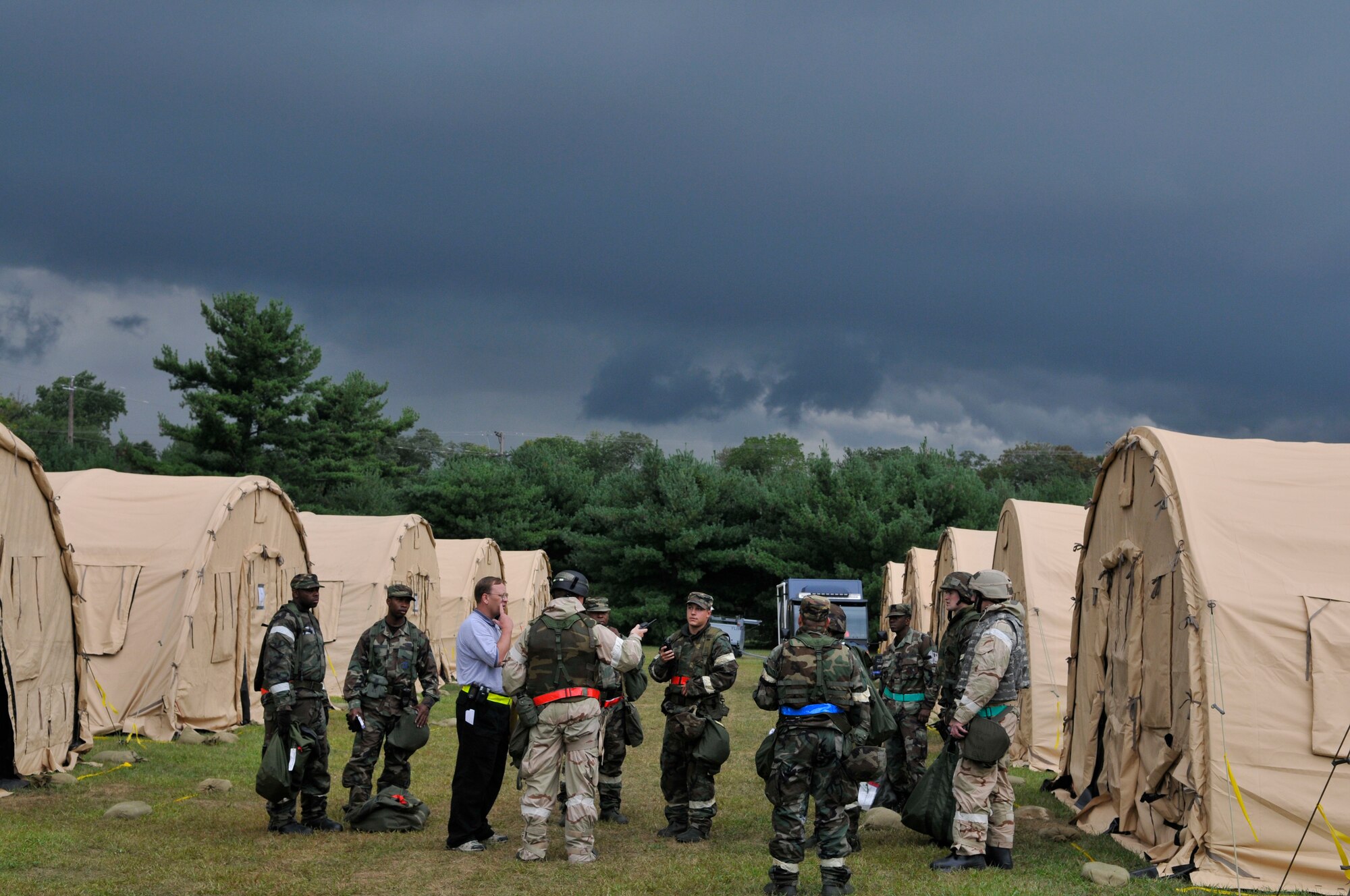 Team McGuire personnel discuss preparations for the looming storm during a mobility exercise here Sept. 8. The exercise is designed to help McGuire personnel prepare for the upcoming Operational Readiness Inspection. (U.S. Air Force photo/Kenn Mann)