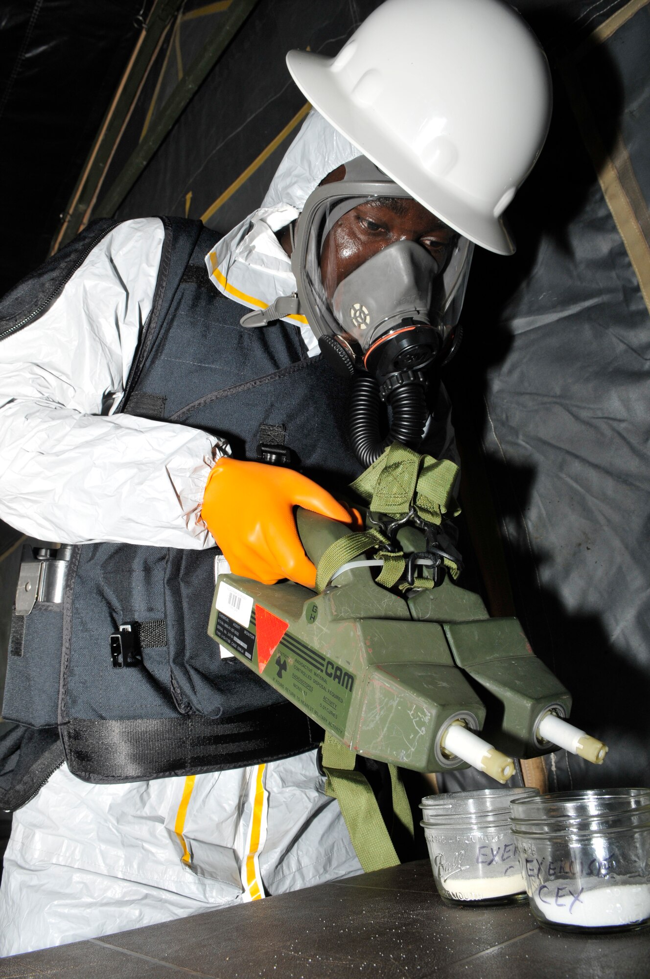 Staff Sgt. Beniteau Fenelus, 305th Civil Engineer Squadron emergency management flight, takes a reading of a “suspicious” substance during a mobility exercise here Sept. 8. The “substance” turned out to be creamer from a supermarket. (U.S. Air Force photo/Kenn Mann)