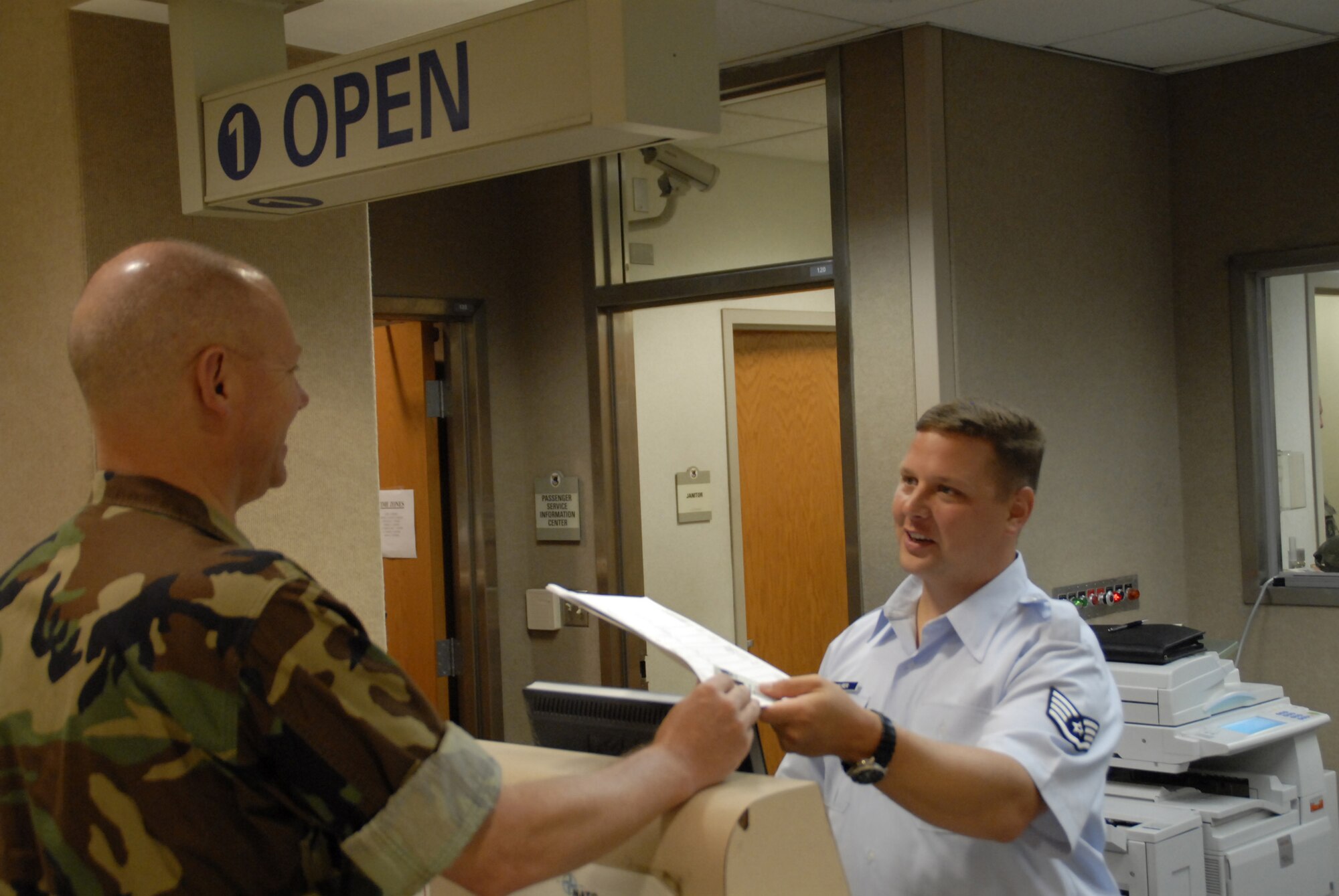 NAVAL STATION NORFOLK, Va. - 87th Aerial Port Squadron member Staff Sergeant Michael Maurer processes U.S. Navy Senior Chief Petty Officer Forrest Davis at the passenger terminal at Naval Station Norfolk. (U.S. Air Force photo/Tech. Sgt. Charlie Miller)