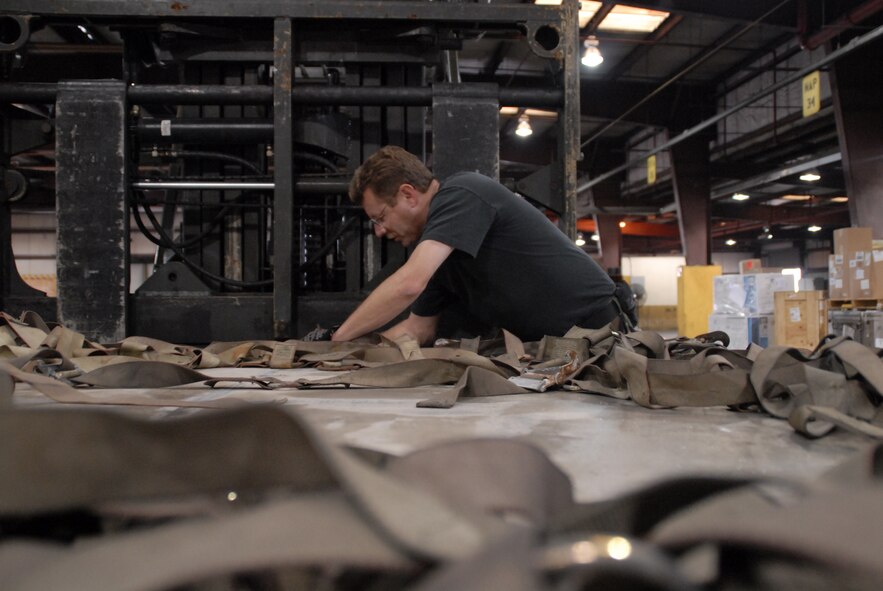 NAVAL STATION NORFOLK, Va. - Staff Sgt. Roger Dils work on a cargo net while participating in Patriot Partner, an annual exercise held at various air force bases around the country. Patriot Partner is a joint forces exercise and the 2008 Patriot Partner Naval Station, Norfolk, Va. hosted three Aerial Port Squadrons, and one Air Guard squadron. (U.S. Air Force photo/Tech. Sgt. Charlie Miller)