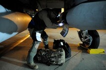 MOODY AIR FORCE BASE, Ga. -- An A-10C Thunderbolt II pilot with the 75th Fighter Squadron, loads his bags before take-off here Sept. 8. The 75th FS deployed from Moody for the first time since its conversion to the A-10C version. (U.S. Air Force photo by Senior Airman Brittany Barker)
