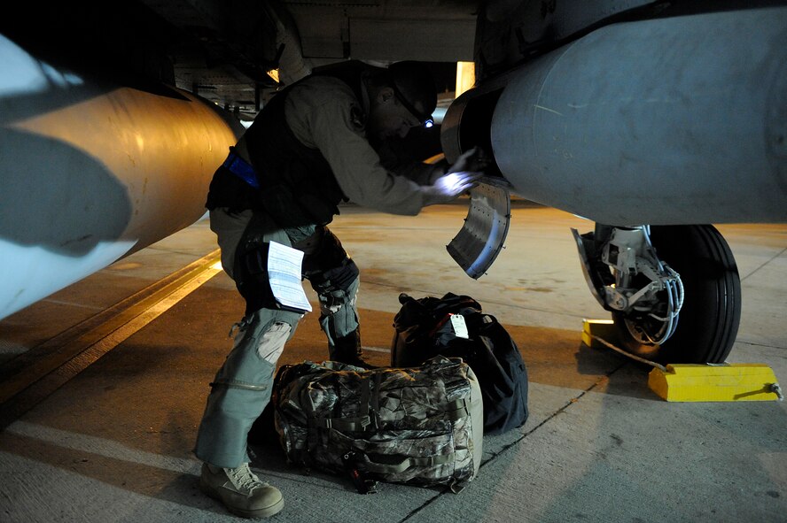MOODY AIR FORCE BASE, Ga. -- An A-10C Thunderbolt II pilot with the 75th Fighter Squadron, loads his bags before take-off here Sept. 8. The 75th FS deployed from Moody for the first time since its conversion to the A-10C version. (U.S. Air Force photo by Senior Airman Brittany Barker)
