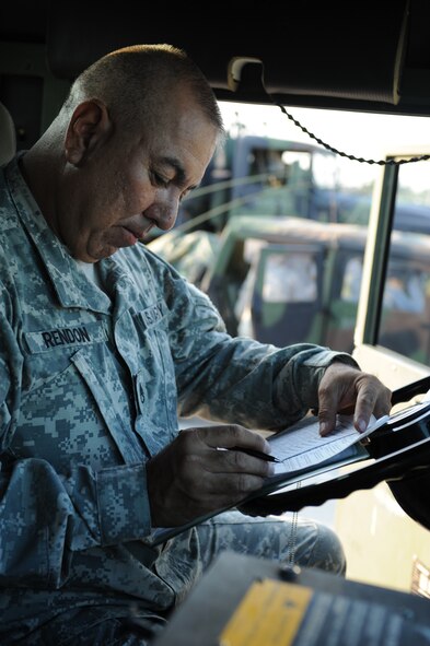 DYESS AIR FORCE BASE, Texas -- Staff Sergeant Armando Rendon, 1200th Infantry Battalion New Mexico Army National Guard, fills out a motor vehicle utilization record in his HM-V, September 2. The paperwork records the miles, hours and maintenance and must be filled out at the beginning and end of each mission, and whenever there is a driver change in the vehicle.  Dyess Airmen are ready and willing to assist and support sister service members whether active duty, guard or reserve. (U.S. Air Force photo/ Senior Airman Courtney Richardson)