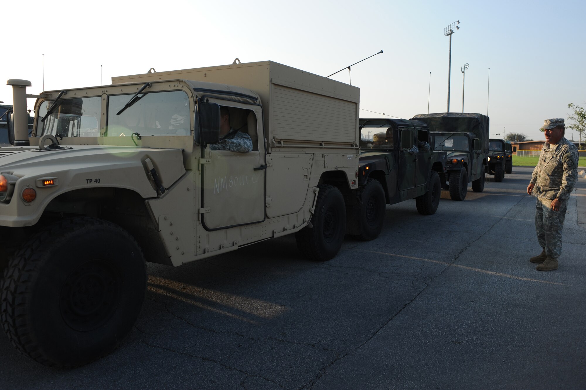 DYESS AIR FORCE BASE, Texas - 1200th Infantry Battalion, New Mexico Army National Guard, line up the convoy for refueling in the Dyess AFB fitness center parking lot, here, Sept. 2.  The battalion stopped at Dyess  AFB because they are only authorized to travel for 17 hours a day allowing them to rest and to check their vehicles and continue their mission. Dyess Airmen are ready and willing to assist and support sister service members whether active duty, guard or reserve. (U.S. Air Force photo/ Senior Airman Courtney Richardson)