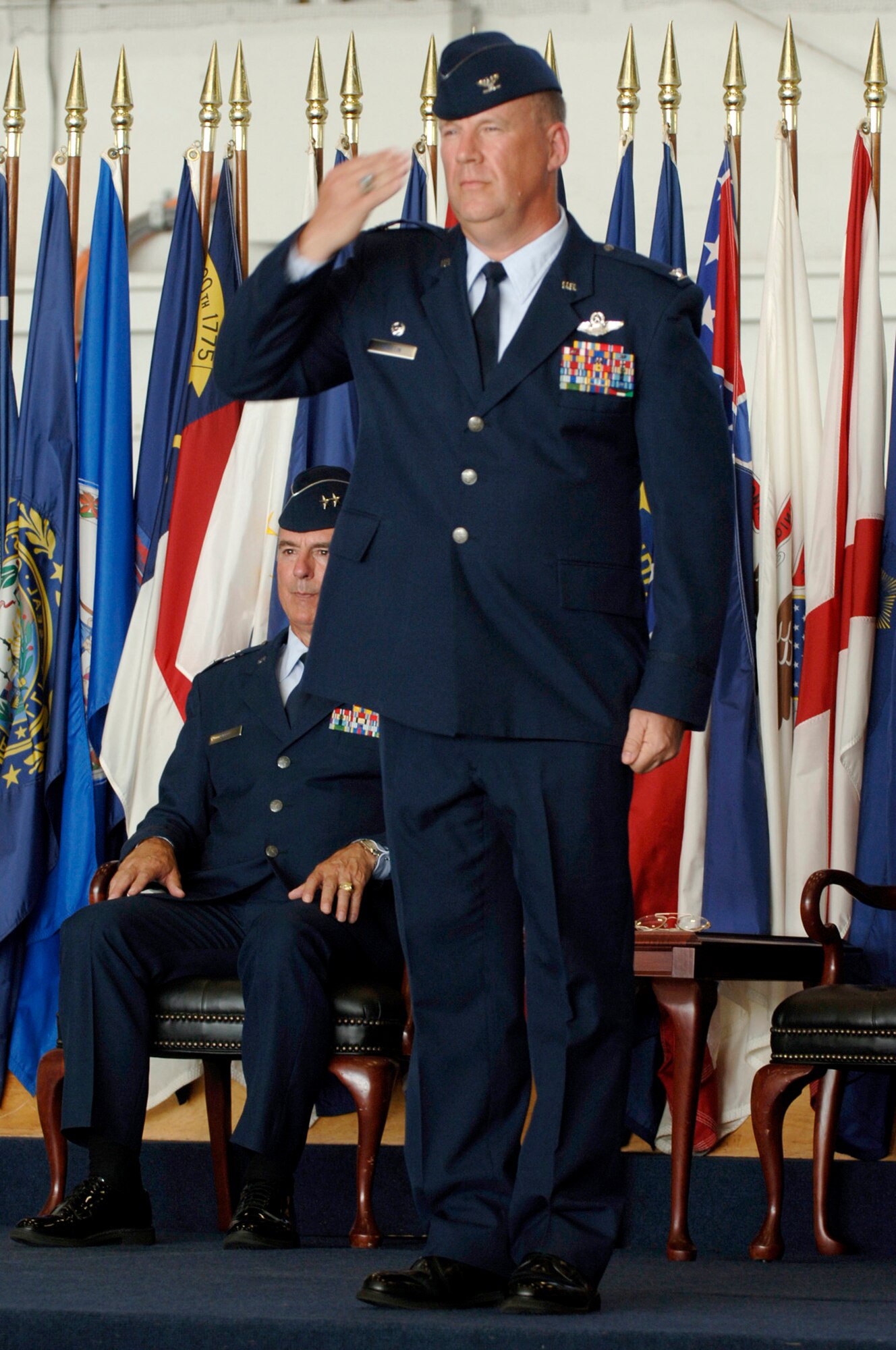 Col. Lawrence Martin salutes members of the 6th Air Mobility Wing during the wing's change of command ceremony Monday. Col. Martin accepted command of the wing during the ceremony.  (U.S. Air Force photo by Staff Sgt. Joseph Swafford)
