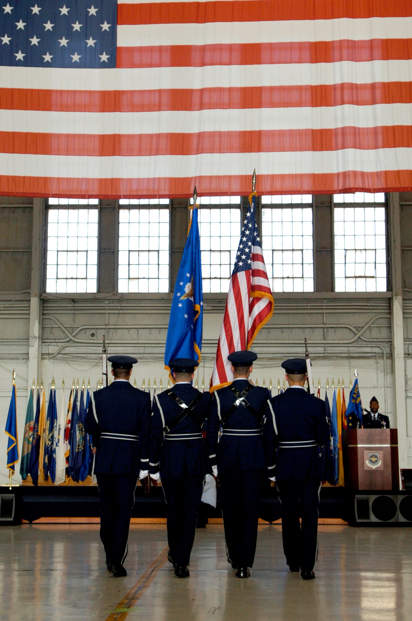 The 6th Air Mobility Wing honor guard post the colors during the wing's change of command ceremony Monday.  (U.S. Air Force photo by Staff Sgt. Joseph Swafford)