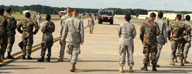 SEYMOUR JOHNSON AIR FORCE BASE, N.C.,-- Team Seymour conducts a foreign object & debris (FOD) check on the flightline after Tropical Storm Hanna hit Seymour Johnson Air Force Base, N.C., Sept. 6. The base recieved minimal damage from the storm. (U.S. Air Force photo by Airman 1st Class Gino Reyes) 
