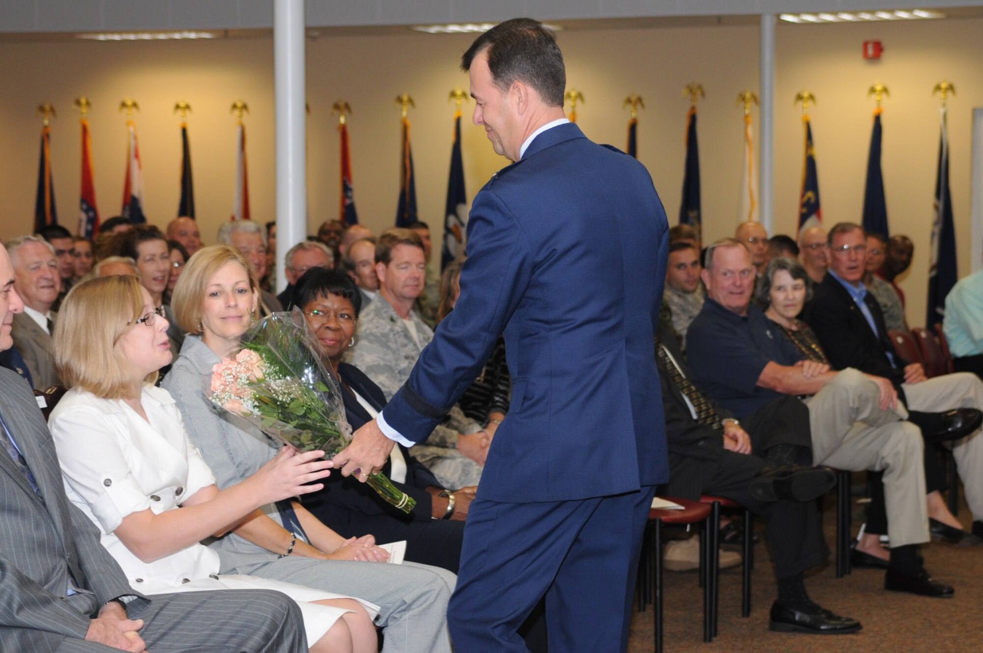 Brig. Gen. Greg Touhill, 81st Trainig Wing commander, gets promoted by Maj. Gen. Al Flowers, 2nd Air Force commander, during a ceremony at the Locker House Events Center  5 Sept. 08.  More than 100 people were in attendance including Biloxi mayor A.J. Holloway, local community leaders and leadership from across Keesler.  Also in attendance were General Touhill's  wife, Charlene and daughter Kate. 