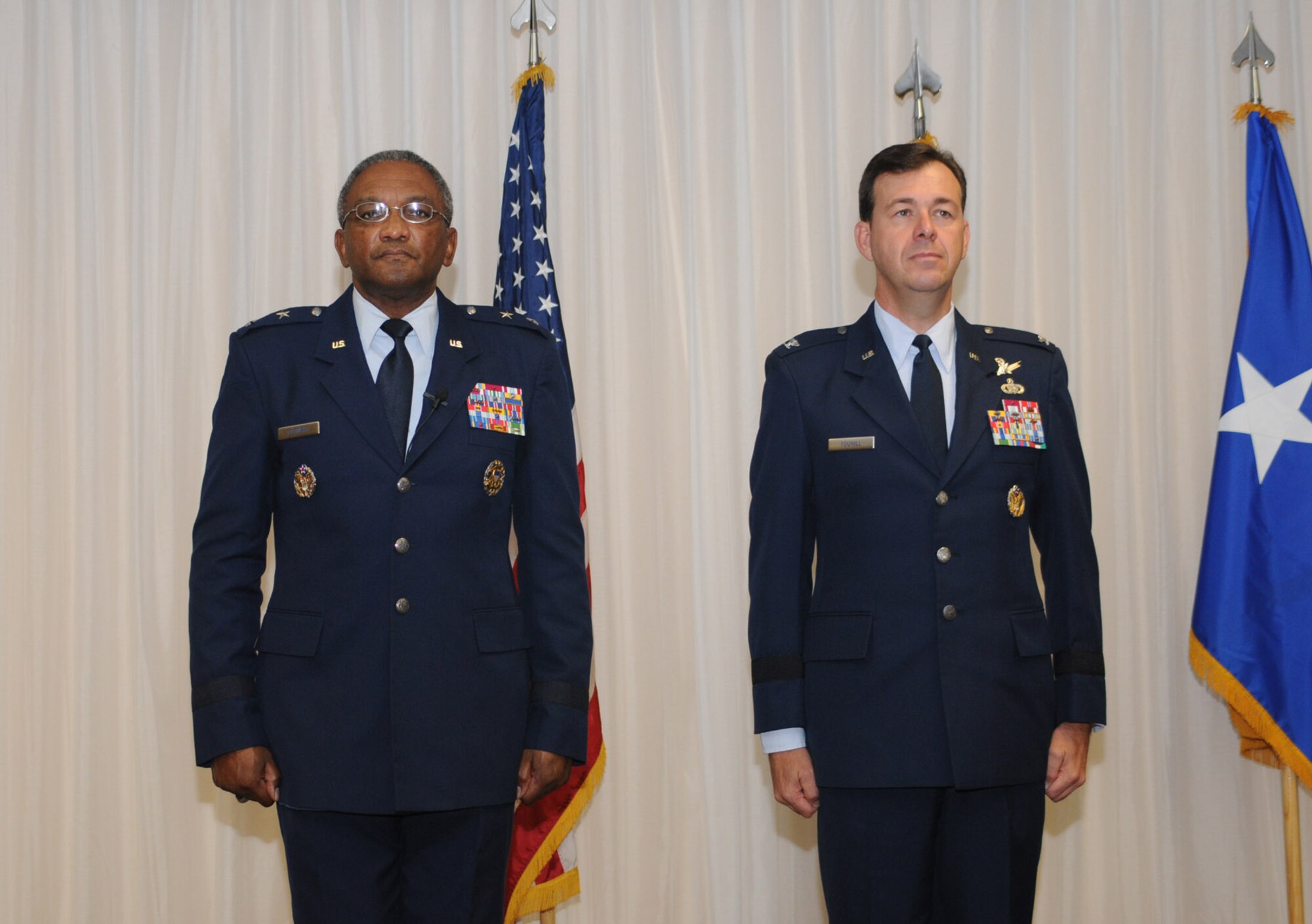 Brig. Gen. Greg Touhill, 81st Trainig Wing commander, gets promoted by Maj. Gen. Al Flowers, 2nd Air Force commander, during a ceremony at the Locker House Events Center  5 Sept. 08.  More than 100 people were in attendance including Biloxi mayor A.J. Holloway, local community leaders and leadership from across Keesler.  Also in attendance were General Touhill's  wife, Charlene and daughter Kate. 