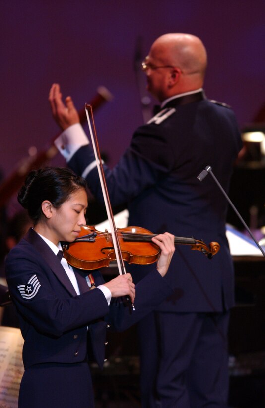 Air Force Strings Concertmaster TSgt Mari Uehara performs an stirring violin solo accompanied by the United States Air Force Orchestra.  The concert was part of the USAF Band's Guest Artist Series at DAR Constitution Hall in Washington, DC.