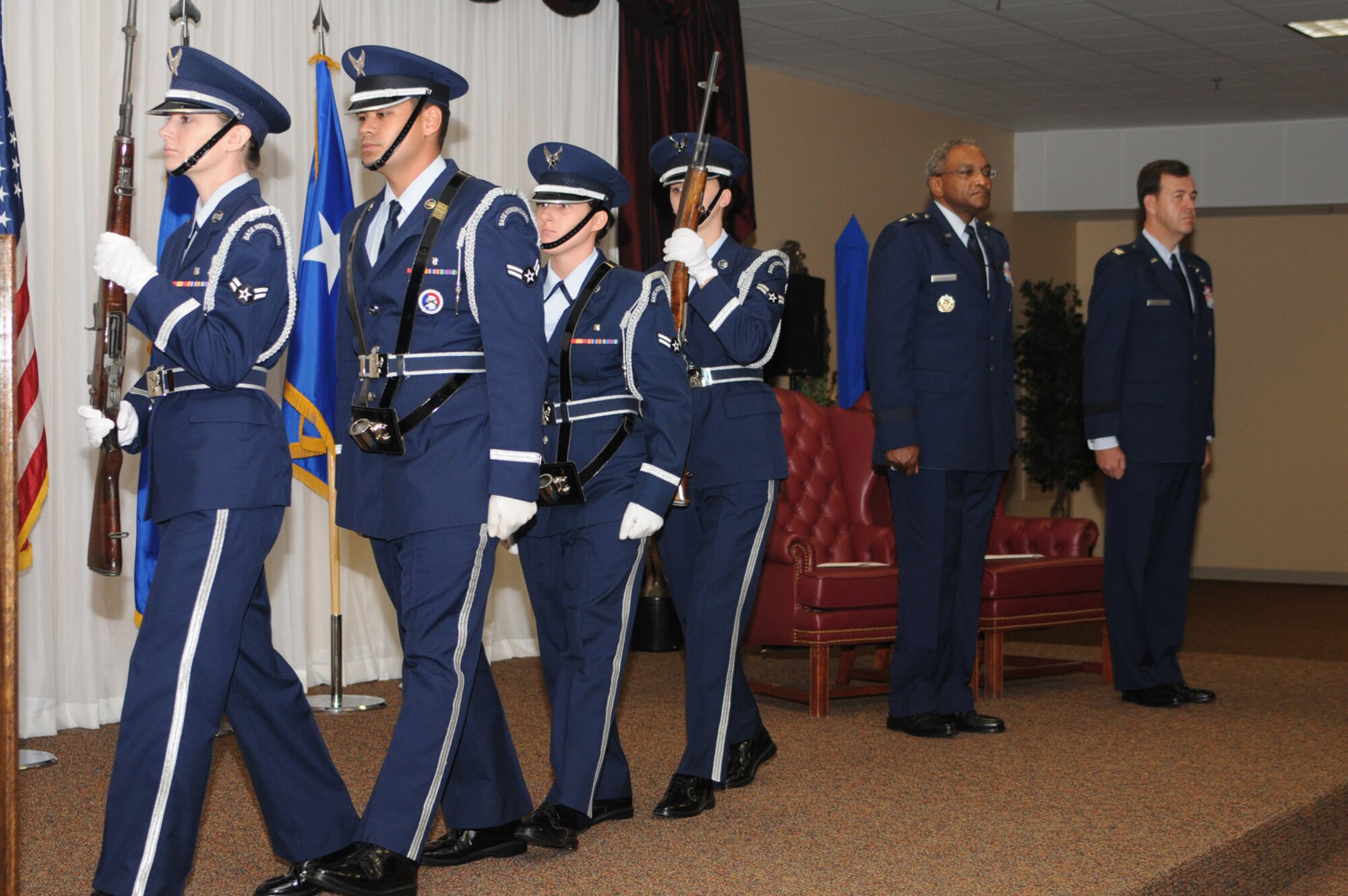 Brig. Gen. Greg Touhill, 81st Trainig Wing commander, gets promoted by Maj. Gen. Al Flowers, 2nd Air Force commander, during a ceremony at the Locker House Events Center  5 Sept. 08.  More than 100 people were in attendance including Biloxi mayor A.J. Holloway, local community leaders and leadership from across Keesler.  Also in attendance were General Touhill's  wife, Charlene and daughter Kate. 
