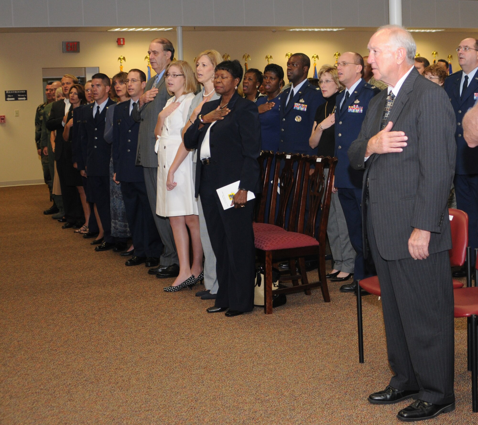 Brig. Gen. Greg Touhill, 81st Trainig Wing commander, gets promoted by Maj. Gen. Al Flowers, 2nd Air Force commander, during a ceremony at the Locker House Events Center  5 Sept. 08.  More than 100 people were in attendance including Biloxi mayor A.J. Holloway, local community leaders and leadership from across Keesler.  Also in attendance were General Touhill's  wife, Charlene and daughter Kate. 