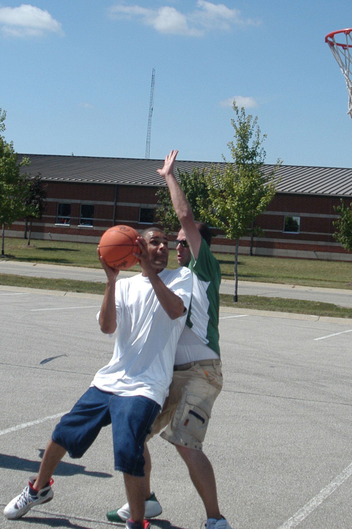 GRISSOM AIR RESERVE BASE, Ind., -- Members of the 434th Air Refueling Wing had an opportunity to hoop it up with three-on-three basketball games during the annual family day picnic. Events were set up for members of all ages to enjoy spending time together. (U.S. Air Force photo/Senior Airman Carl Berry)