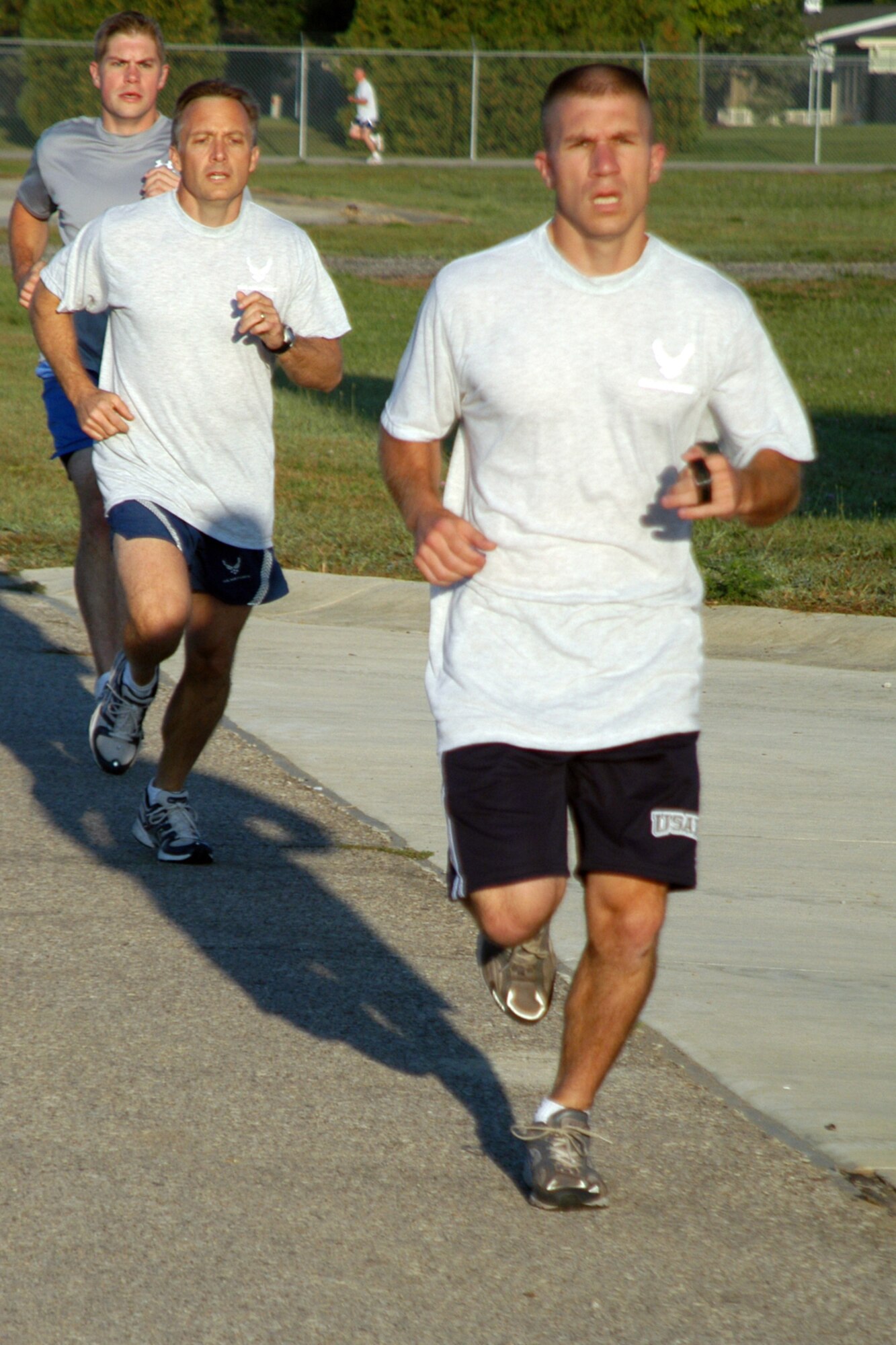 GRISSOM AIR RESERVE BASE, Ind.,-- Being physically fit is an important part of serving in the military. The physical fitness test for the Air Force consists of a 1.5 mile run, one minute of sit-ups and one minute of push-ups. Capt. Dan Keeney, 74th Air Refueling Squadron pilot, leads a group of Airmen taking their physical fitness test during the September unit training assembly. (U.S. Air Force photo/ Senior Airman Carl Berry)                              