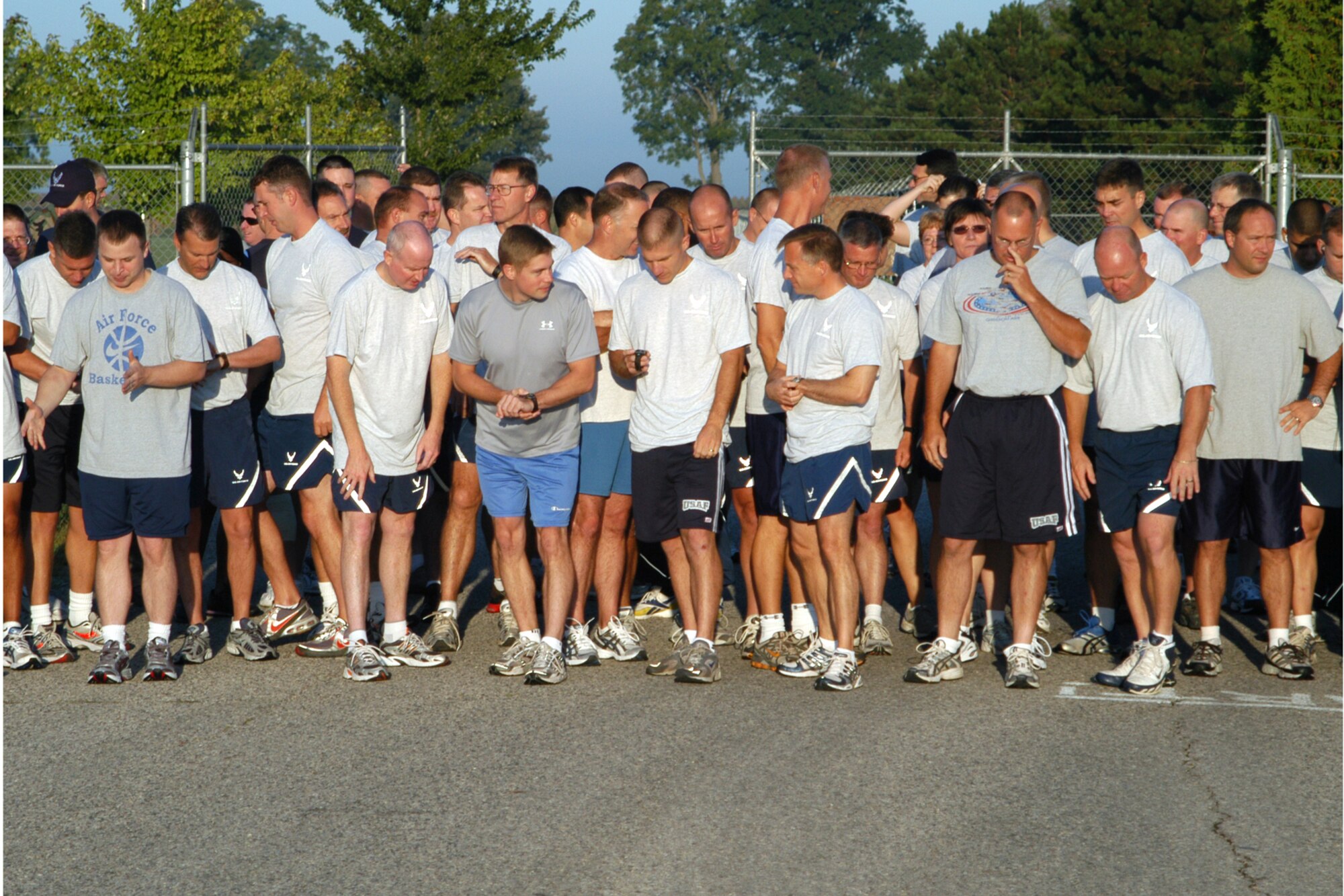 GRISSOM AIR RESERVE BASE, Ind., -- The fitness motto for the Air Force is 'Fit to Fight'. The physical fitness test for the Air Force consists of a 1.5 mile run, one minute of push-ups and one minute of sit-ups. Here a group of Airmen prepare to run the standard 1.5 miles for the physical fitness test during the September unit training assembly. (U.S. Air Force photo/Senior Airman Carl Berry)