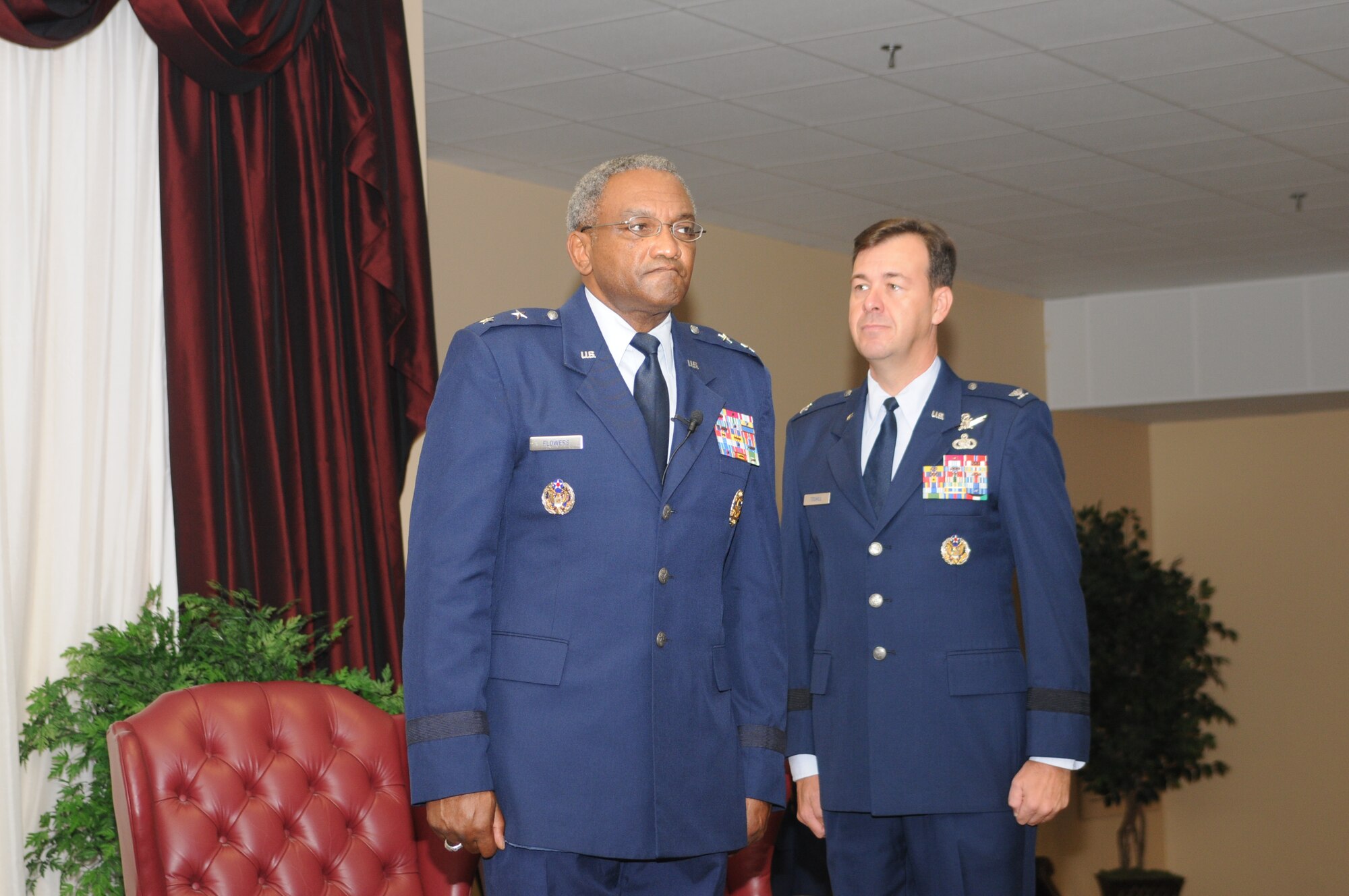 Brig. Gen. Greg Touhill, 81st Trainig Wing commander, gets promoted by Maj. Gen. Al Flowers, 2nd Air Force commander, during a ceremony at the Locker House Events Center  5 Sept. 08.  More than 100 people were in attendance including Biloxi mayor A.J. Holloway, local community leaders and leadership from across Keesler.  Also in attendance were General Touhill's  wife, Charlene and daughter Kate. 