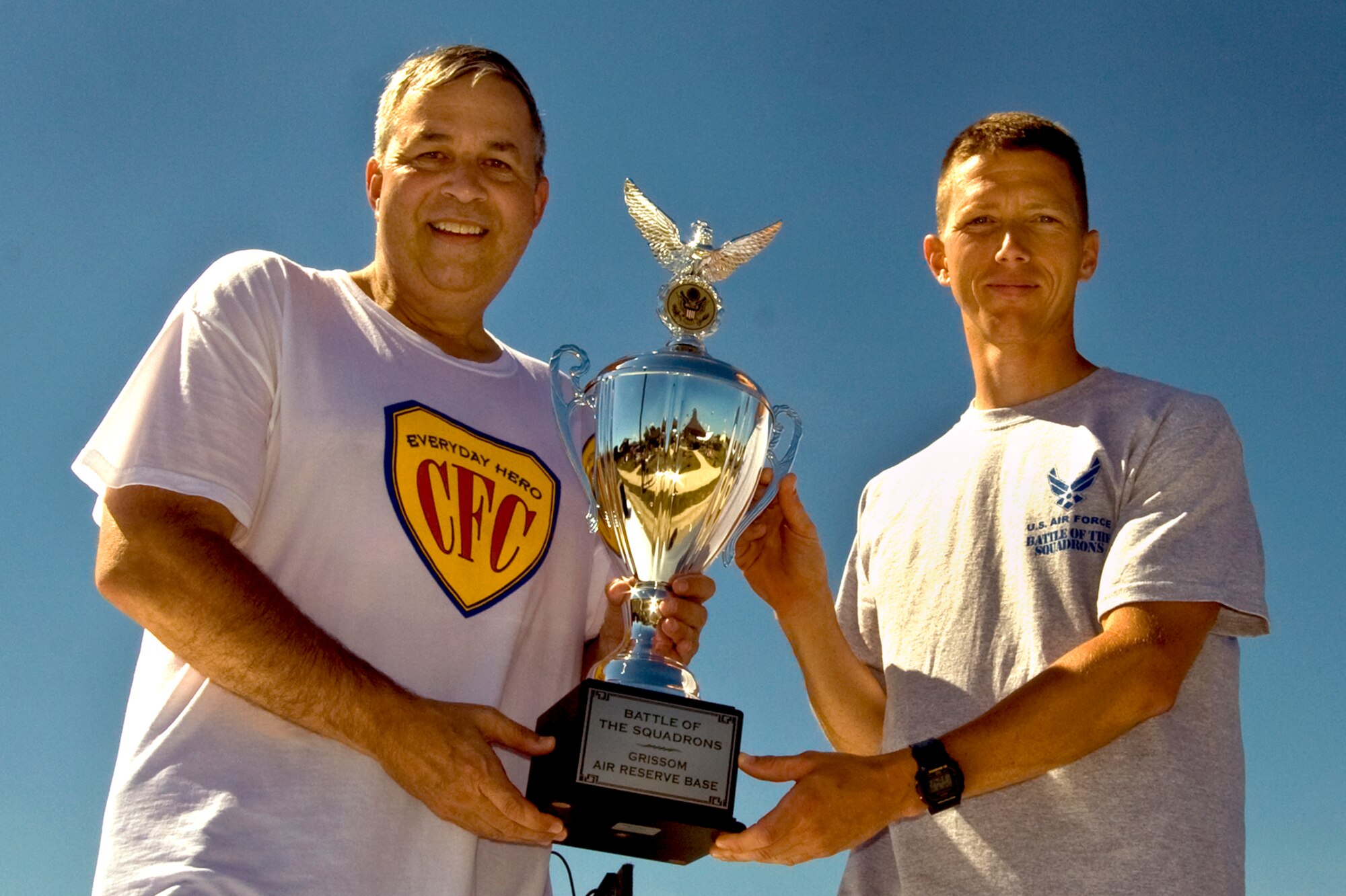 GRISSOM AIR RESERVE BASE, Ind., -- Brig. Gen. Dean Despinoy, 434th Air Refueling Wing commander, left, presents the battle of the squadron's trophy to Capt. William Chapman, 434th Maintenance Group executive officer, during the annual family day picnic. Captain Chapman won the 5K fun run with a time of 18 minutes and 15 seconds. (U.S. Air Force photo/Tech. Sgt. Patrick Kuminecz)