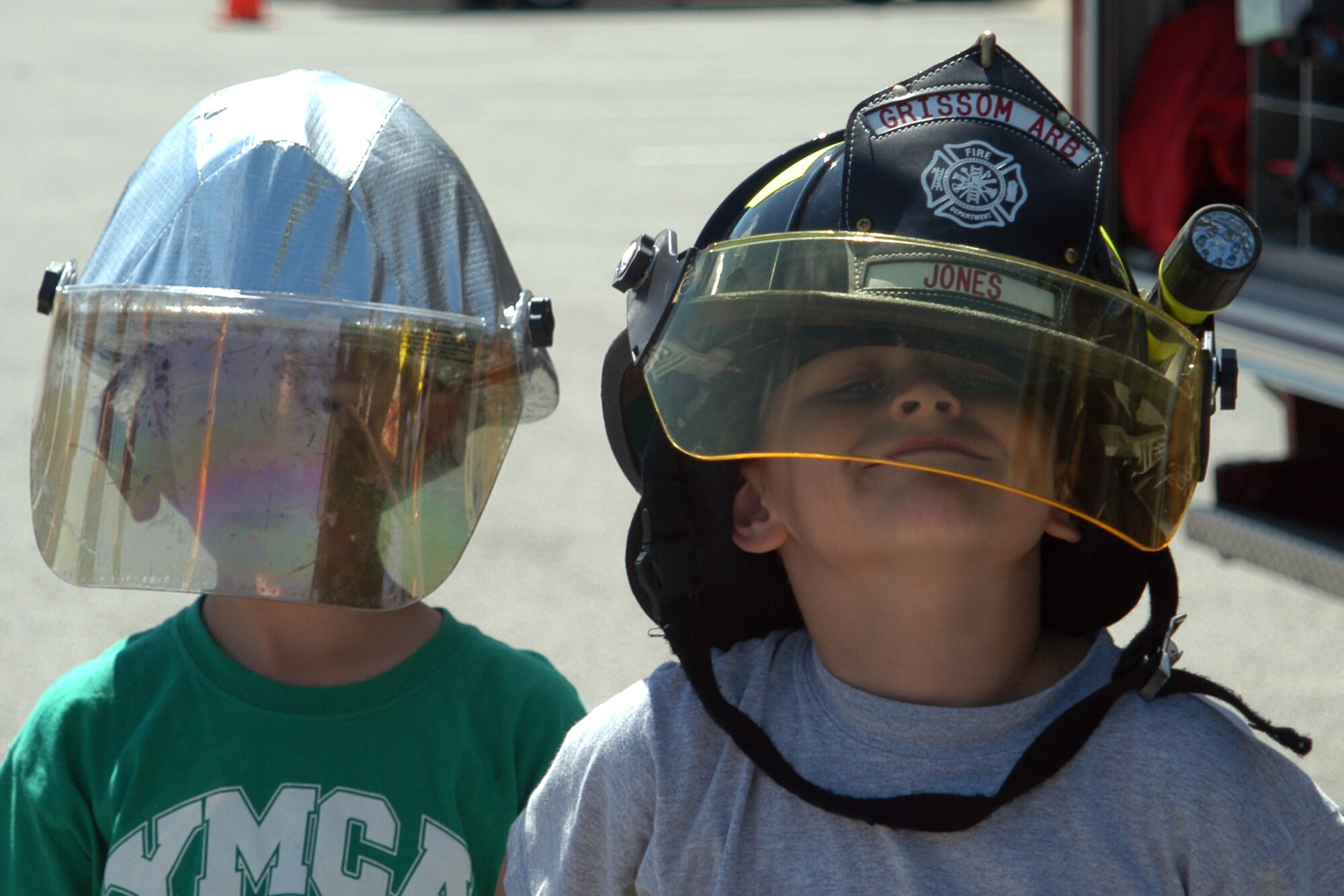 GRISSOM AIR RESERVE BASE, Ind., -- Two youngsters took the opportunity to try on some fire fighting protective equipment during the annual family appreciation day picnic. (U.S. Air Force photo/Master Sgt. Rob Hoffman)