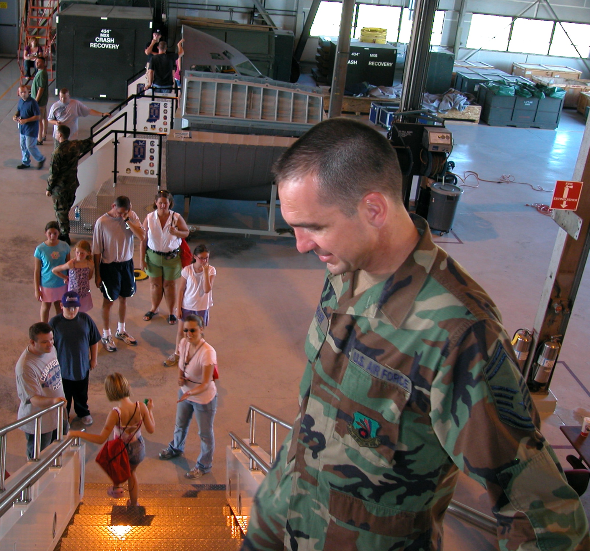 GRISSOM AIR RESERVE BASE, Ind., -- Senior Master Sgt. Chuck Hoover, a flight chief for the 434th Aircraft Maintenance Squadron, stands ready to assist visitors touring a KC-135R Stratotanker during Grissom's annual family day picnic. (U.S. Air Force photo/Staff Sgt. Chris Bolen)