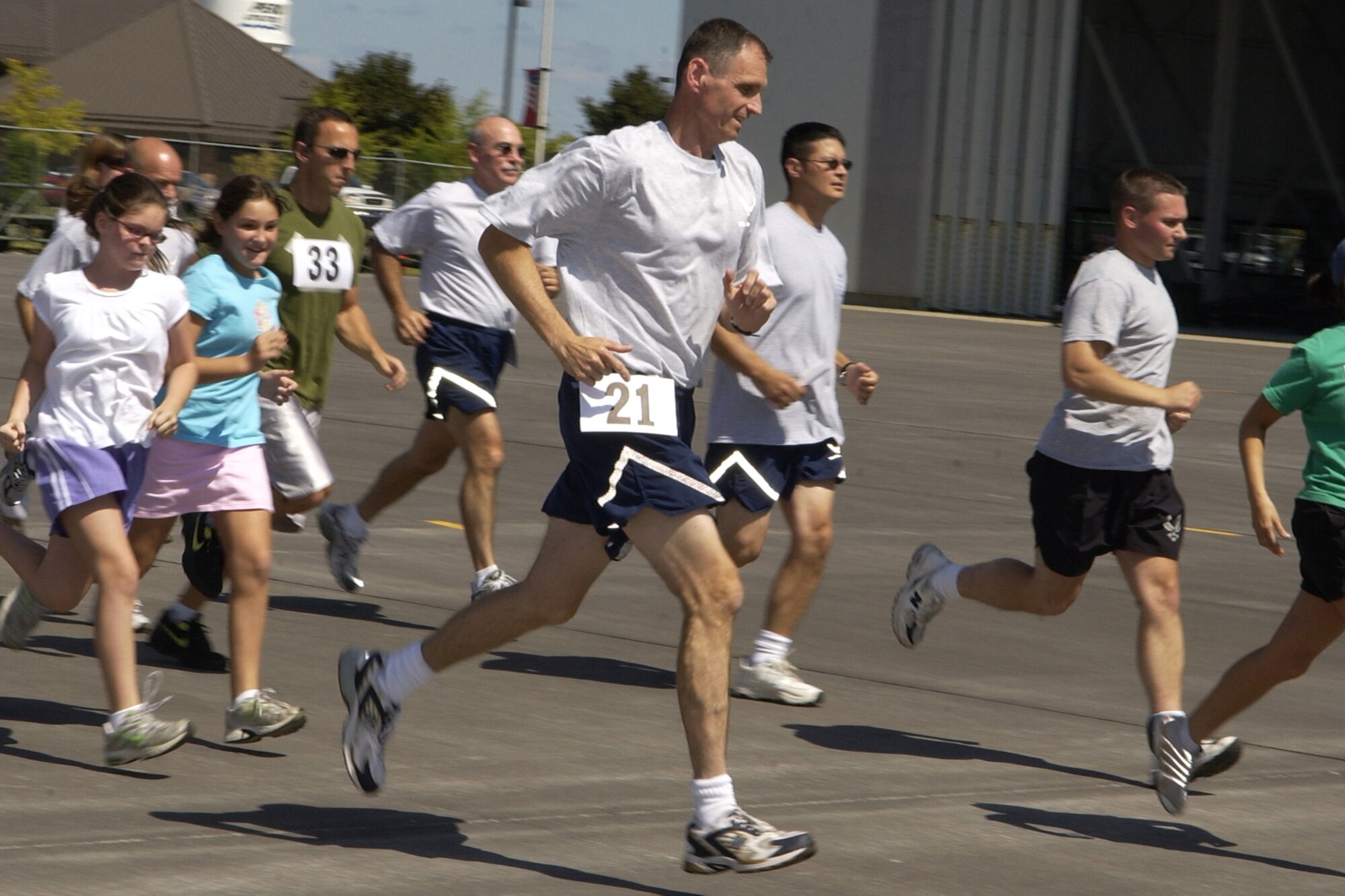 GRISSOM AIR RESERVE BASE, Ind.,  -- Runners, including number 21 Marty Foye, 434th Logistics Readiness Squadron commander, race down the airfield ramp during a 5K fun run held during Grissom's Family Day festivities. Foye finished seventh overall. William Chapman won the race with a time of 18 minutes and 15 seconds. (U.S. Air Force photo/Staff Sgt. Mark R. W. Orders-Woempner)