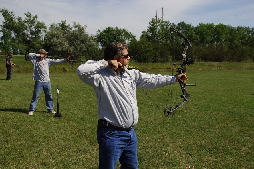 MINOT AIR FORCE BASE, N.D.—Staff Sgt. Joe Austin, 5th Civil Engineer Squadron heavy equipment operator, takes a few practice shots before the beginning of the archery tournament held Sept. 3 and Sept. 5 at the Minot AFB outdoor archery range. The two-day archery tournament is one of many outdoor events put on by base Outdoor Recreation. For more information on Outdoor Recs outdoor activities, log on to http://www.5thforcesupport.com/activities/outdoor/index.htm. (U.S. Air Force photo by Senior Airman Cassandra Jones)