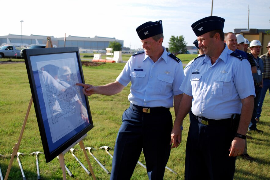 Colonel Gregory L. Ferguson, 137th Air Refueling Wing commander and Col. Jeffery R. Glass, 507th Air Refueling Wing commander look over the floor plan design for a new joint use squadron operations building to be used by both wings.
  Both were attending a groundbreaking ceremony on Tinker Air Force Base yesterday for new $8 million facility.
  The 137th ARW, and Oklahoma Air National Guard wing, and the 507th ARW, an Air Force Reserve Command wing began joint associate unit operations last January. This represents the first time an ANG wing has been associated with an AFRC wing.