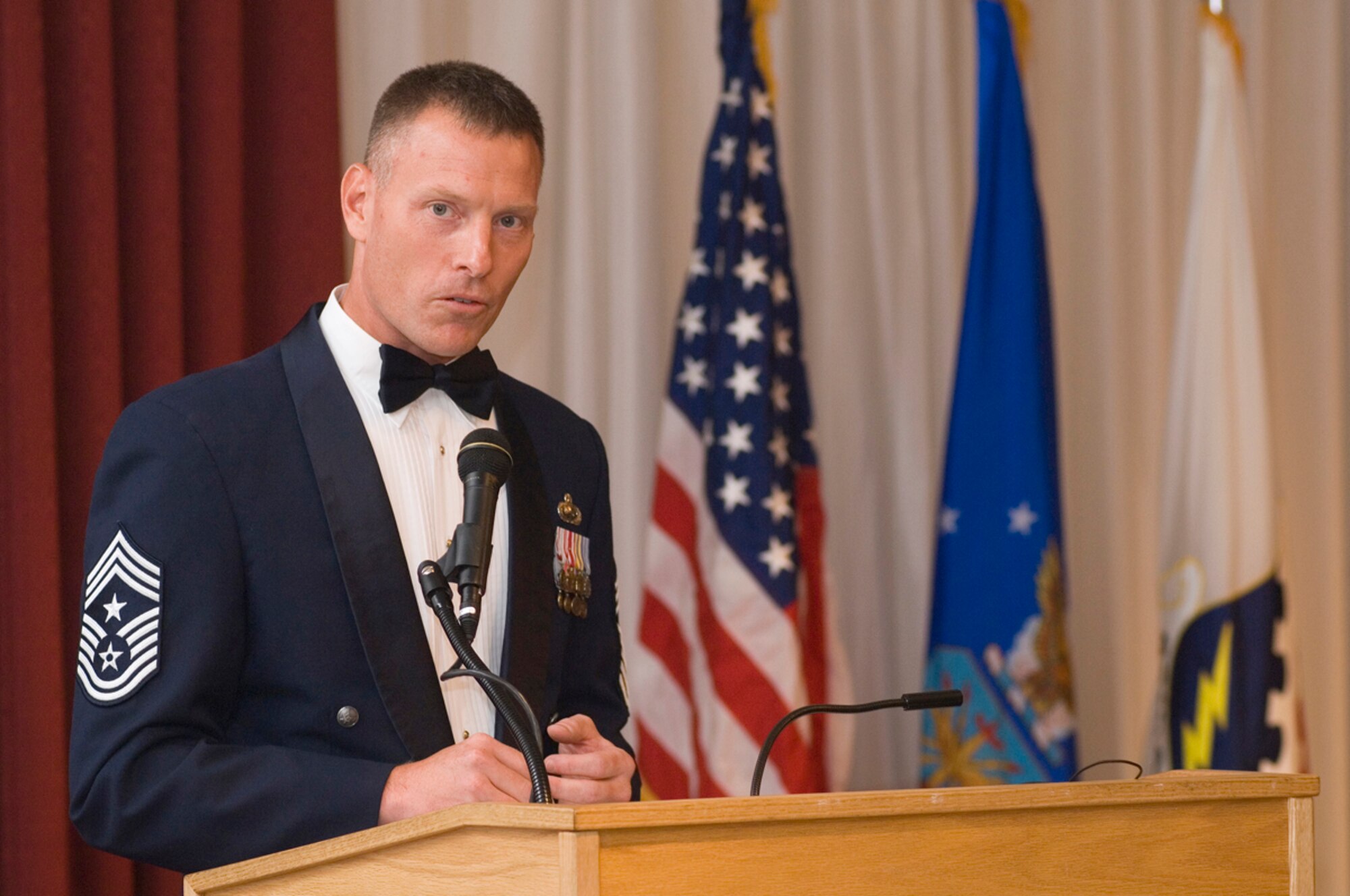 HANSCOM AFB, Mass. -- Air Force Materiel Command Chief Master Sergeant, Chief Bill Gurney addresses soon-to-be senior noncommissioned officers and their guests during Hanscom's Senior NCO Induction Ceremony here, Sept. 4. Chief Gurney visited Hanscom Sept. 3-5. The chief is responsible for advising AFMC's commander and senior staff on matters concerning effective utilization, training, education and readiness of the command's 12,700 enlisted Airmen. (U.S. Air Force photo by Mark Wyatt)
