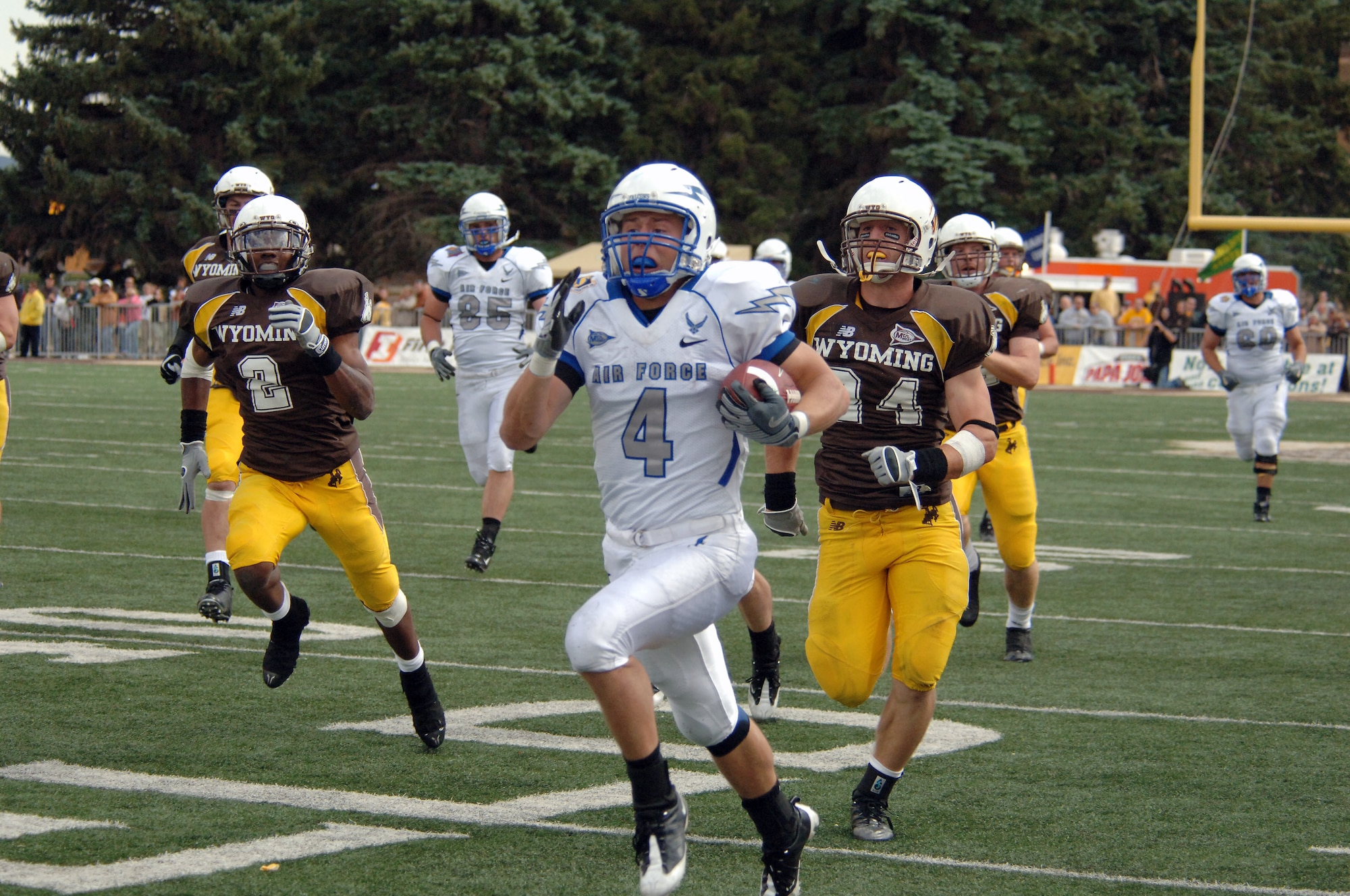 U.S. Air Force Academy wide receiver Kyle Halderman races down the sideline for a 74-yard gain, which set up the Falcons' first touchdown of the game Sept. 6 in Laramie, Wyo. Halderman finished with three rushes for 85 yards in the Falcons' 23-3 win over Wyoming. (U.S. Air Force photo/John Van Winkle)
