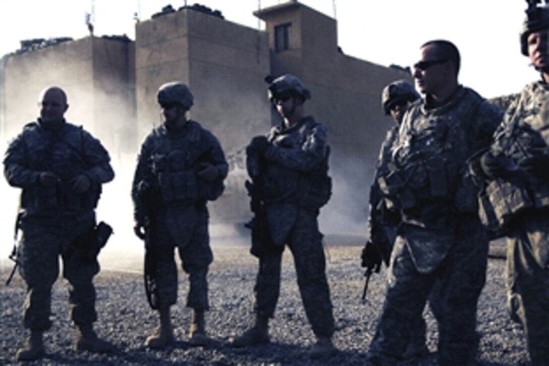 U.S. Army soldiers listen to a mission briefing before they leave from the Joint Security Station Ghazaliyah four, Iraq, Sept. 6, 2008. The soldiers are assigned to the 101st Airborne Division's Company C, 1st Squadron, 75th Cavalry. 