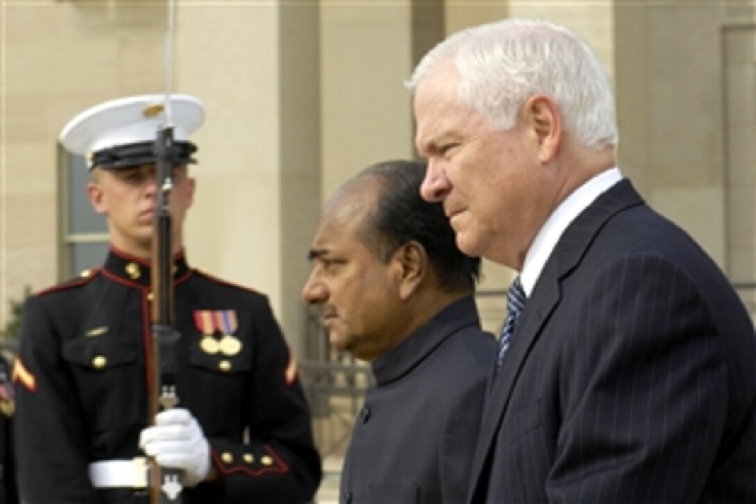 Defense Secretary Robert M. Gates, right, stands with Indian Minister of Defense A. K. Antony at the Pentagon, Sept. 9, 2008, to watch an Armed Forces full honor arrival ceremony to commemorate the visit.  Later, the two defense leaders met to discuss a range of bilateral security issues of interest to both nations.  