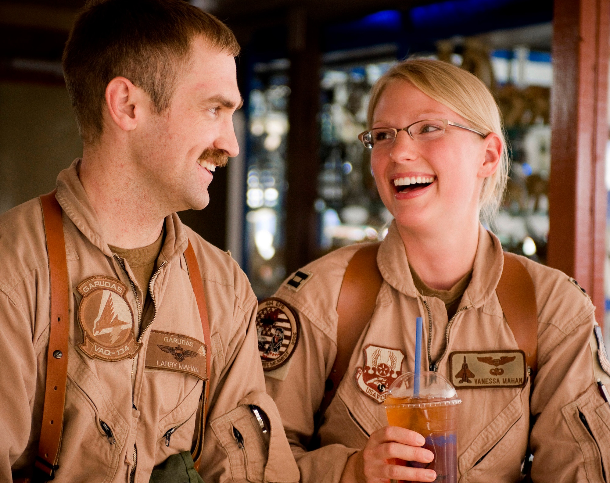 Navy Lt. Larry Mahan and his wife, Capt. Vanessa Mahan, celebrate their first anniversary with iced tea Sept. 1 at Bagram Air Field, Afghanistan. The couple celebrated together with the help of the Captain Mahans's home unit, the 335th Fighter Squadron from Seymour Johnson Air Force Base, N.C., and the 455th Air Expeditionary Wing here. Captain Mahan is an F-15E Strike Eagle weapons systems officer from St. John, Ind. (U.S. Air Force photo/Staff Sgt. Samuel Morse) 
